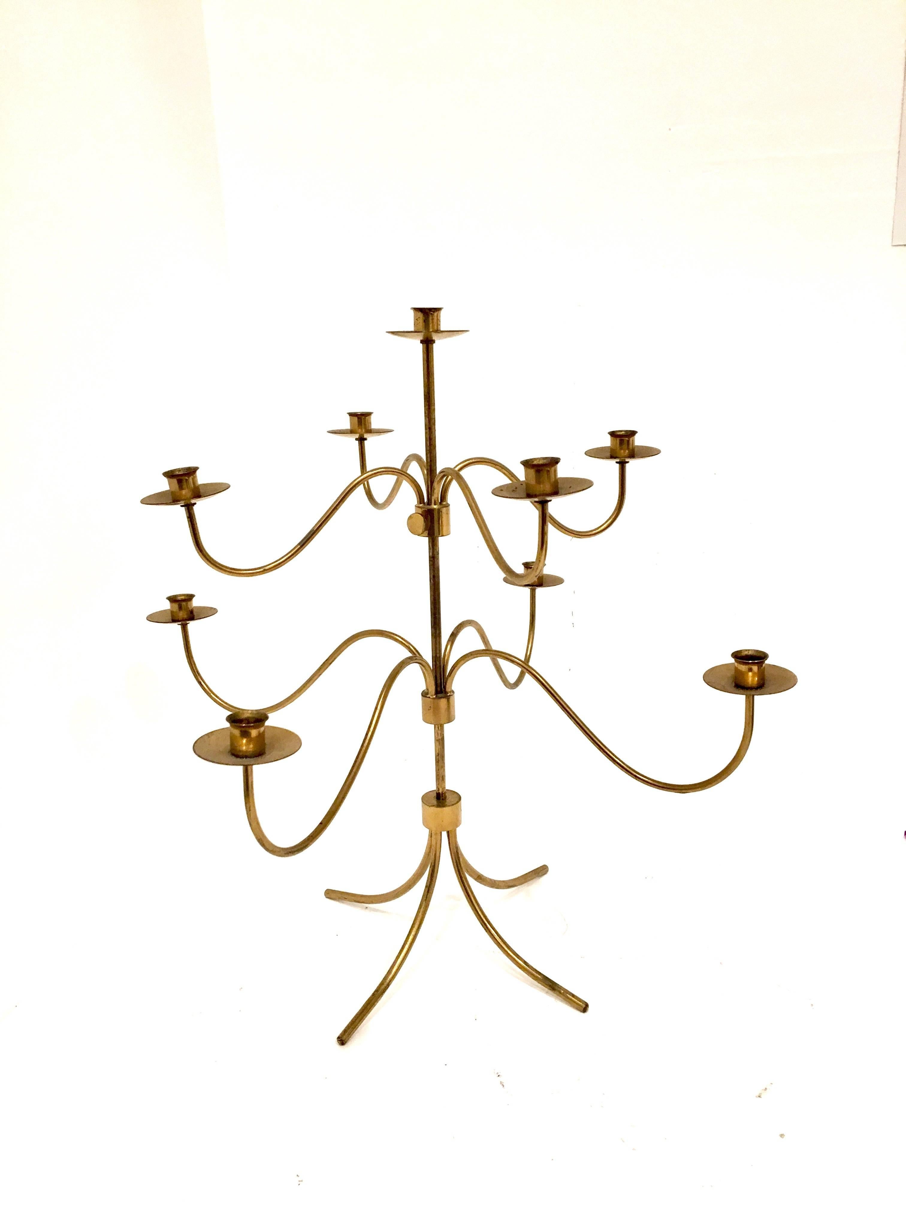 Danish Modern brass candelabra, by Hans Bergstrom, Sweden, circa 1950s. made in Sweden with adjustable arms that move up and down.