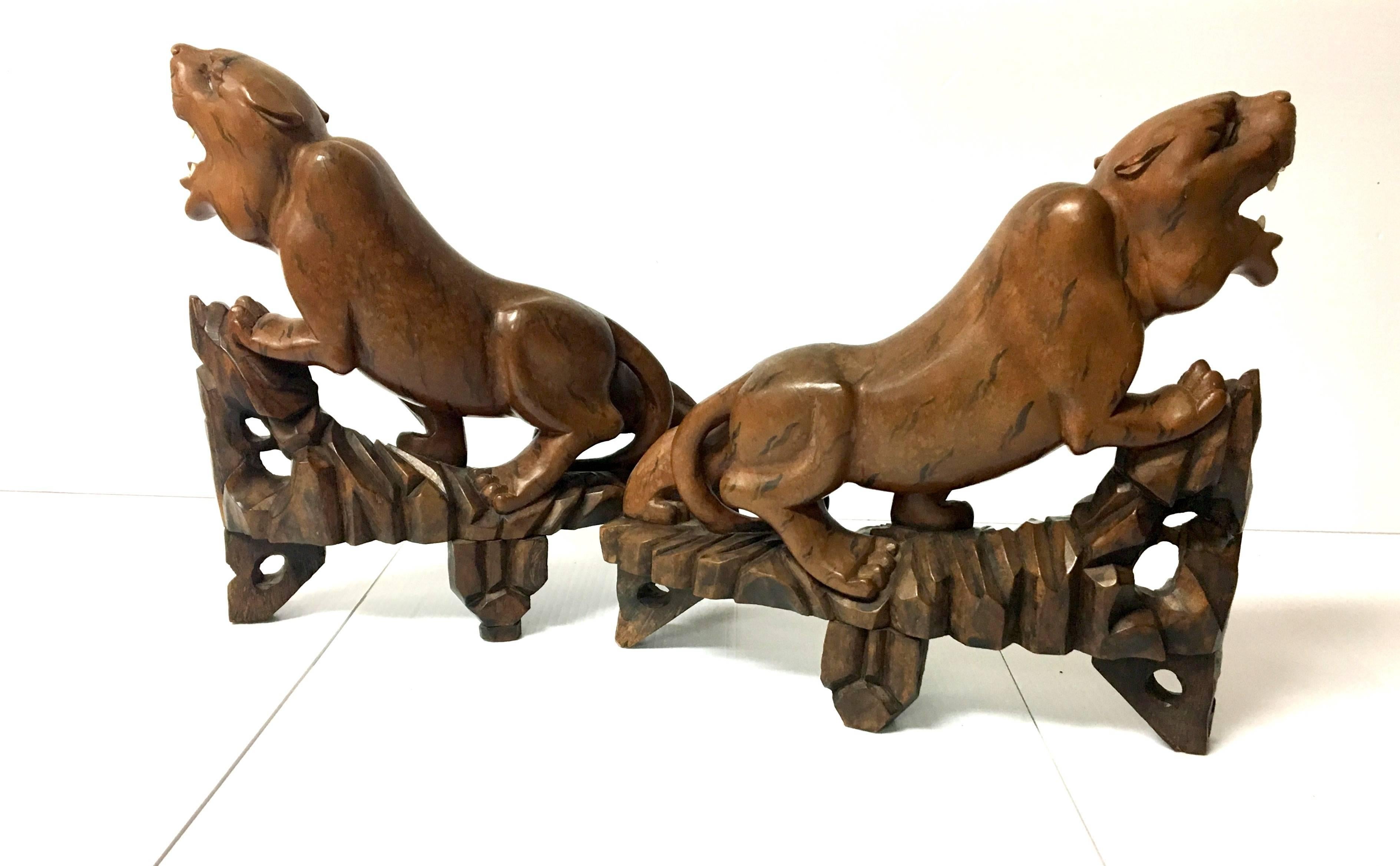 A very cool and unique pair of rosewood carved panthers, circa 1960s.