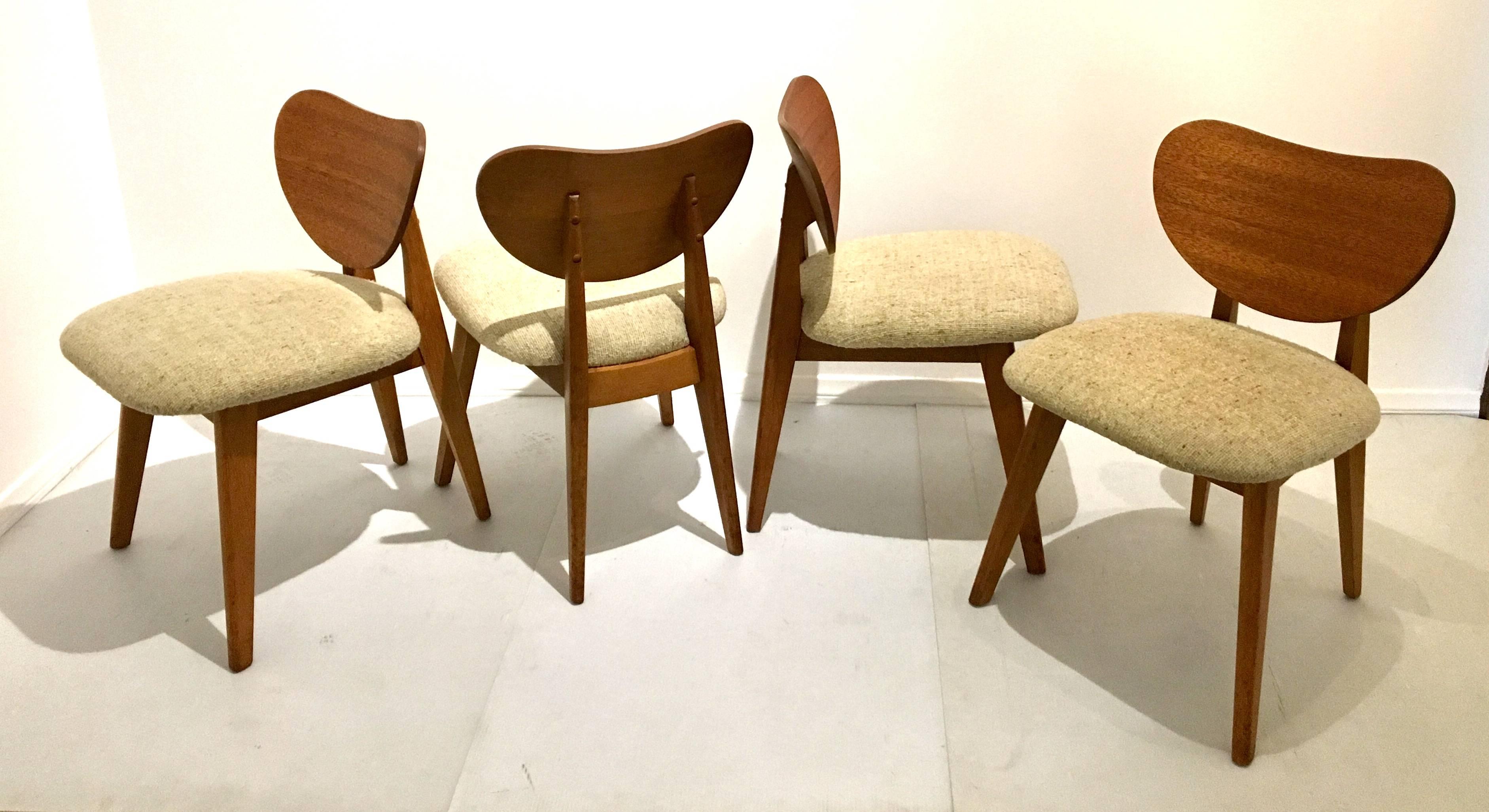 Beautiful set of rare dining chairs, by Brown Saltman, circa 1950s in mahogany each chair its solid and sturdy and recover in beautiful wool cream color material.
