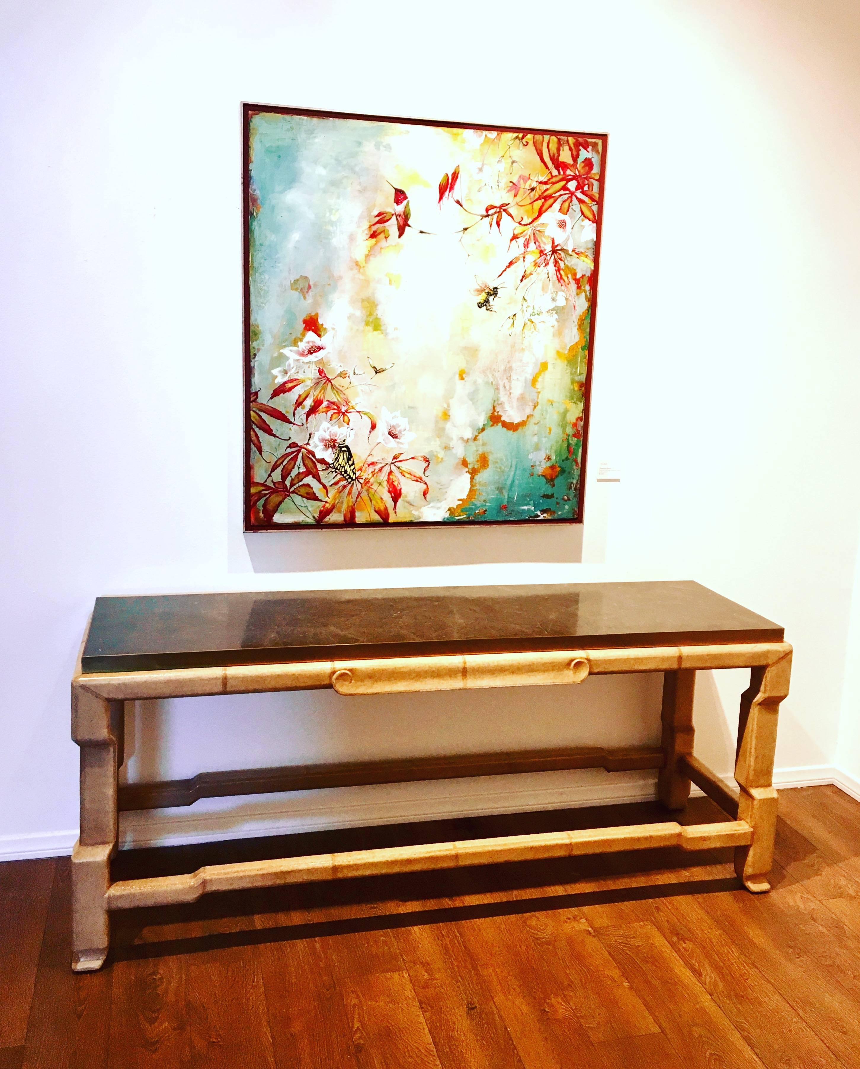 Beautiful impressive console table by Marge Carson furniture in marble pieces top, with solid brass edge with leather wrapped base, circa 1990s.