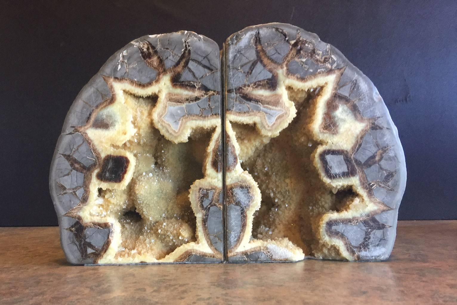 Gorgeous pair of very large geode bookends, circa 1960s. Bookends can be set in two positions (see pictures), exposing different color options and textures. Truly a unique gift!