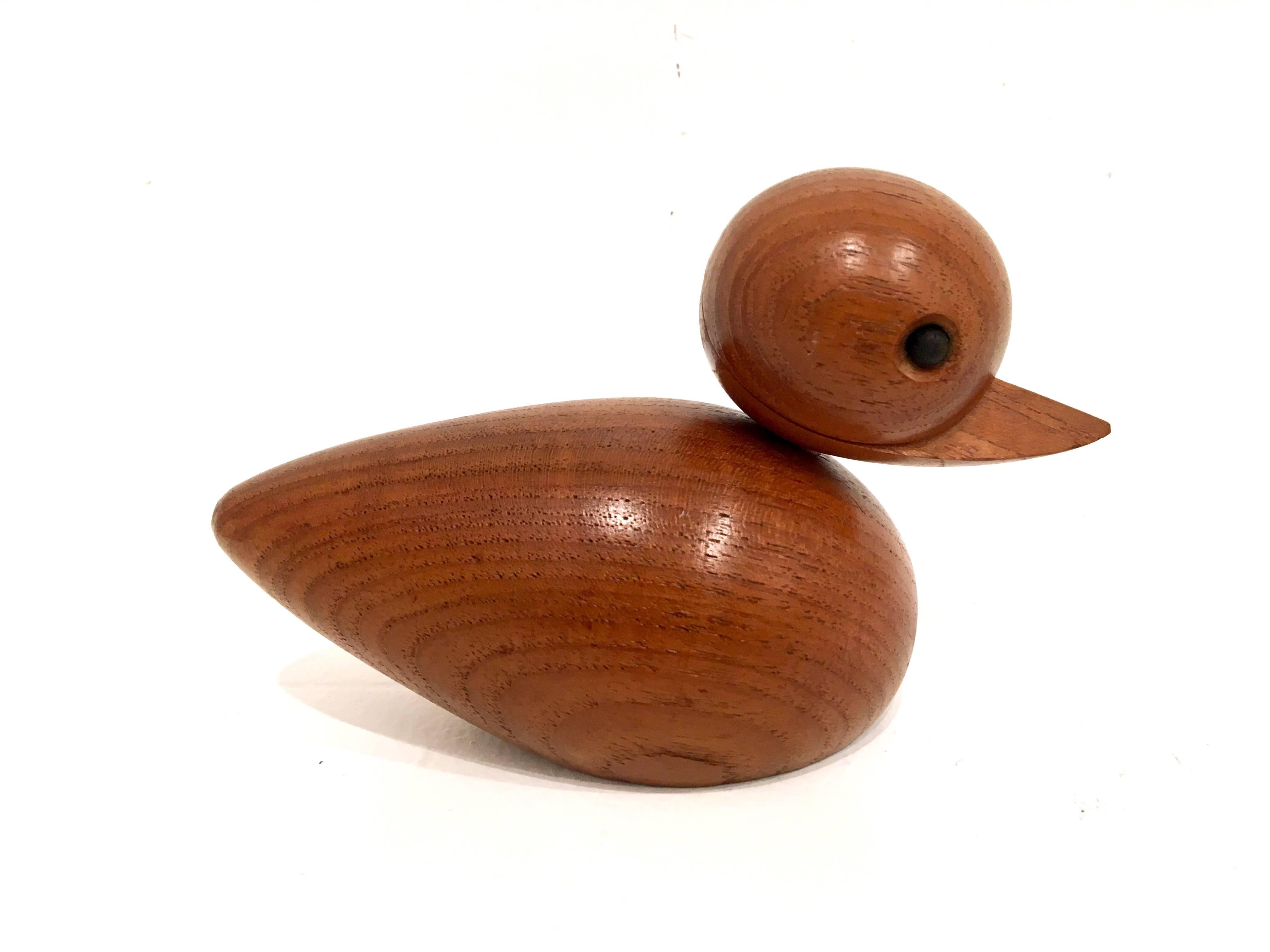 Nice solid duckie sculpture with removable rotating head , circa 1950s.