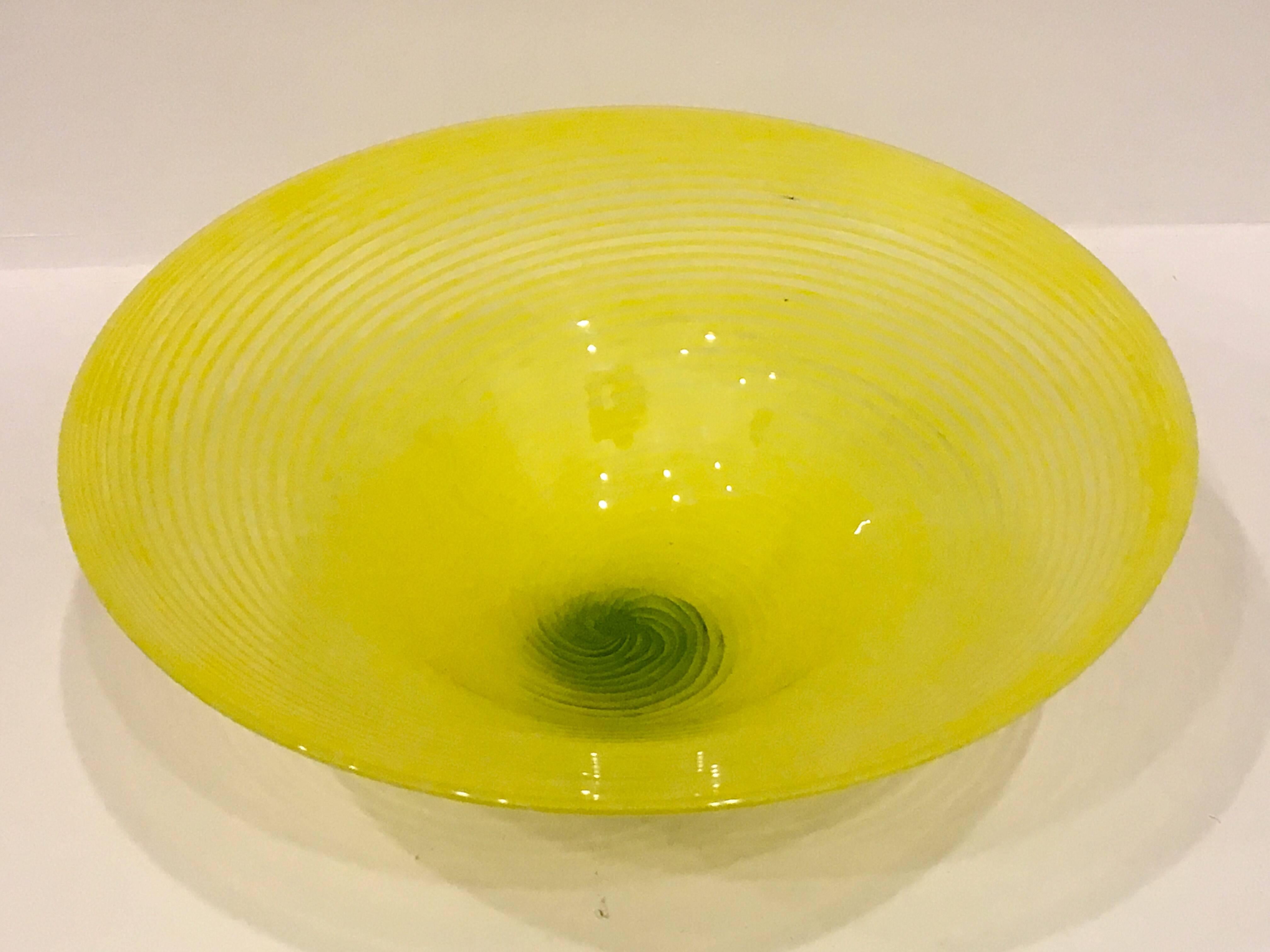 Nice unique vase signed by Dale Chihuly circa year 2000, beautiful striped glass in lemon color with green bottom excellent condition no chips or cracks.