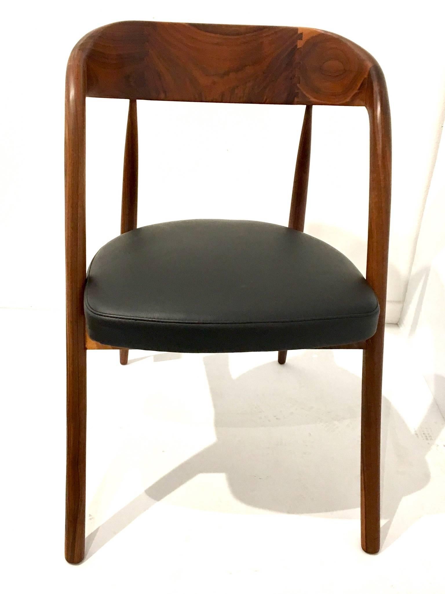 An incredible solid walnut frame chair in the style of Sam Maloof, circa 1950s freshly refinished and recover the seat in black Naugahyde, in credible craftsmanship solid and sturdy , a piece of art. Dovetail back support.