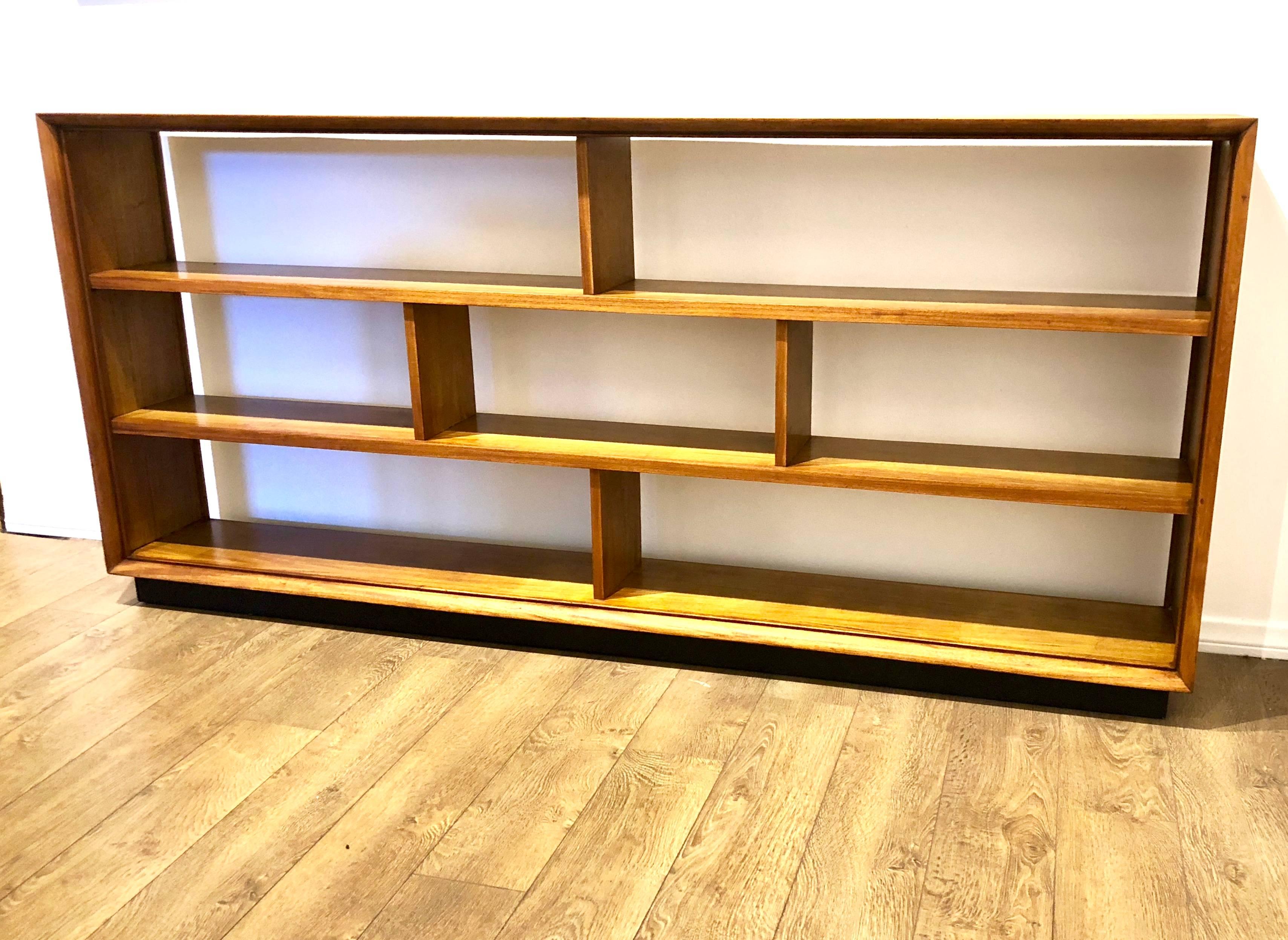 Beautiful long well made piece freshly refinished very nice and clean condition, nice beveled edge refinished in both sides, can be used as room divider, with black lacquered base. Measure: With 9.5" space in between shelves.