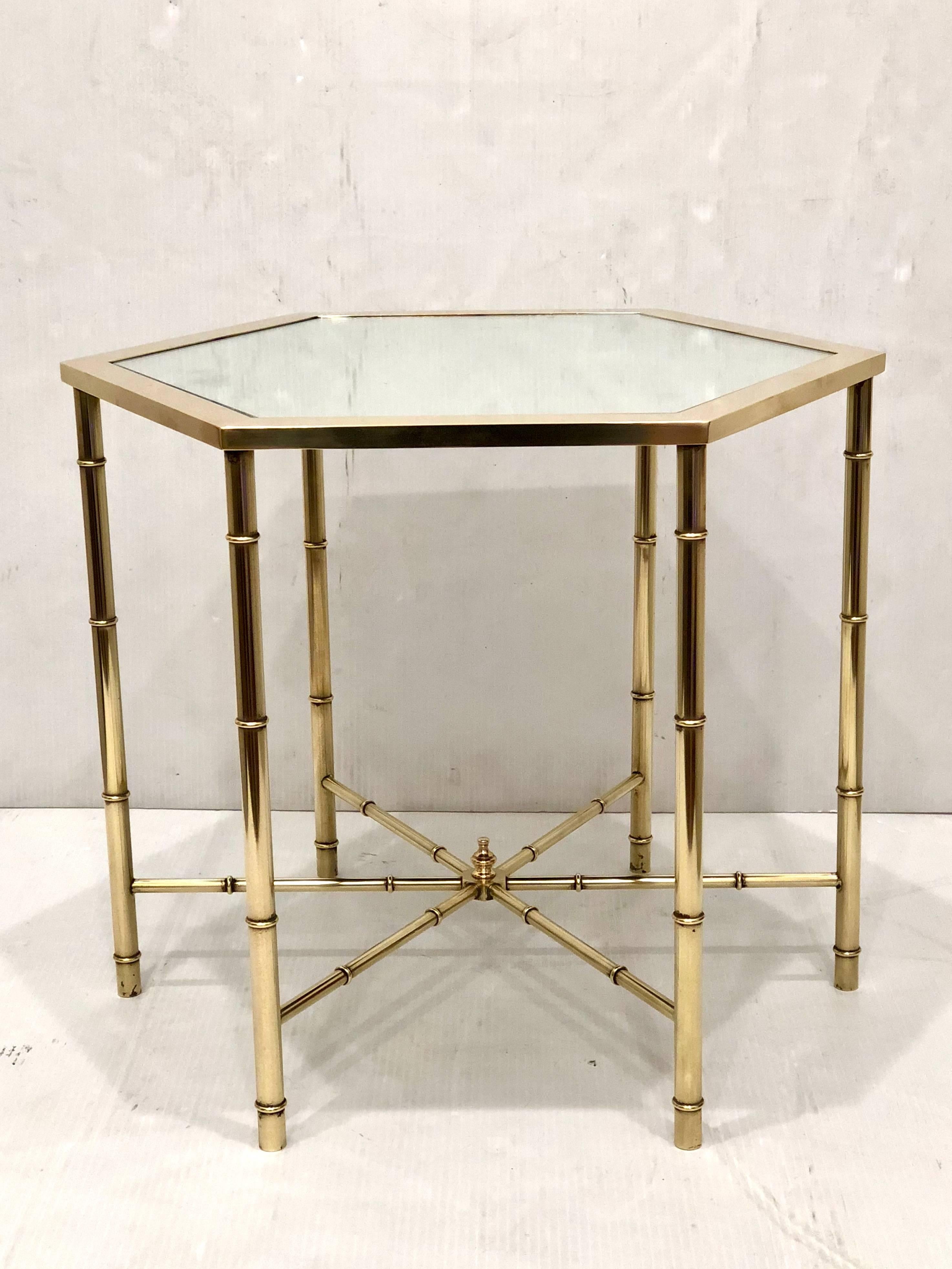 Elegant pair of freshly polished brass hexagonal cocktail of end tables, with new mirrored tops striking, versatile and unique.