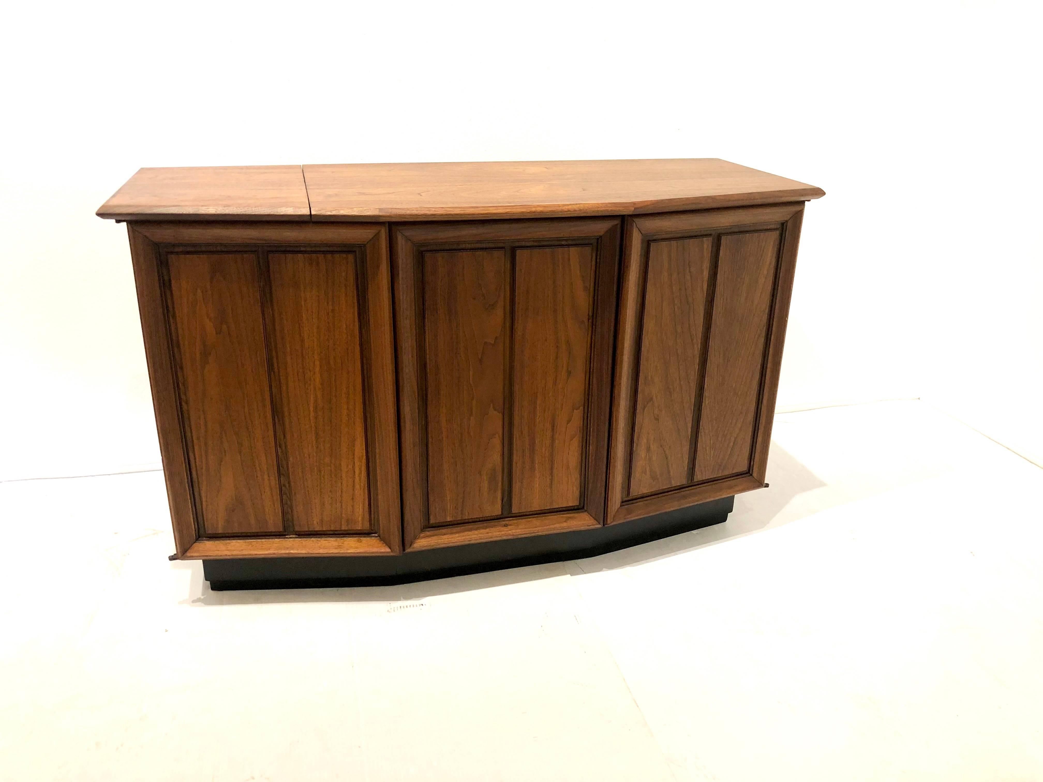 Totally restored American walnut stereo cabinet by Fisher, circa 1960s, dual turntable and fisher stereo receiver, with extra plug to connect your I phone or MP3 player, the item has been serviced and works great, it’s been taken all apart and