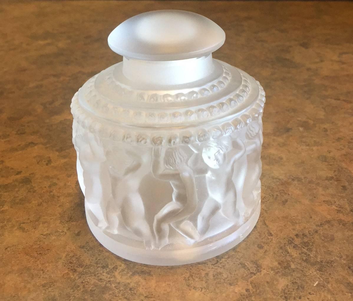 Gorgeous frosted crystal powder jar with cherub motif by Lalique of France, circa 1970s. Measures: The jar is 3.5