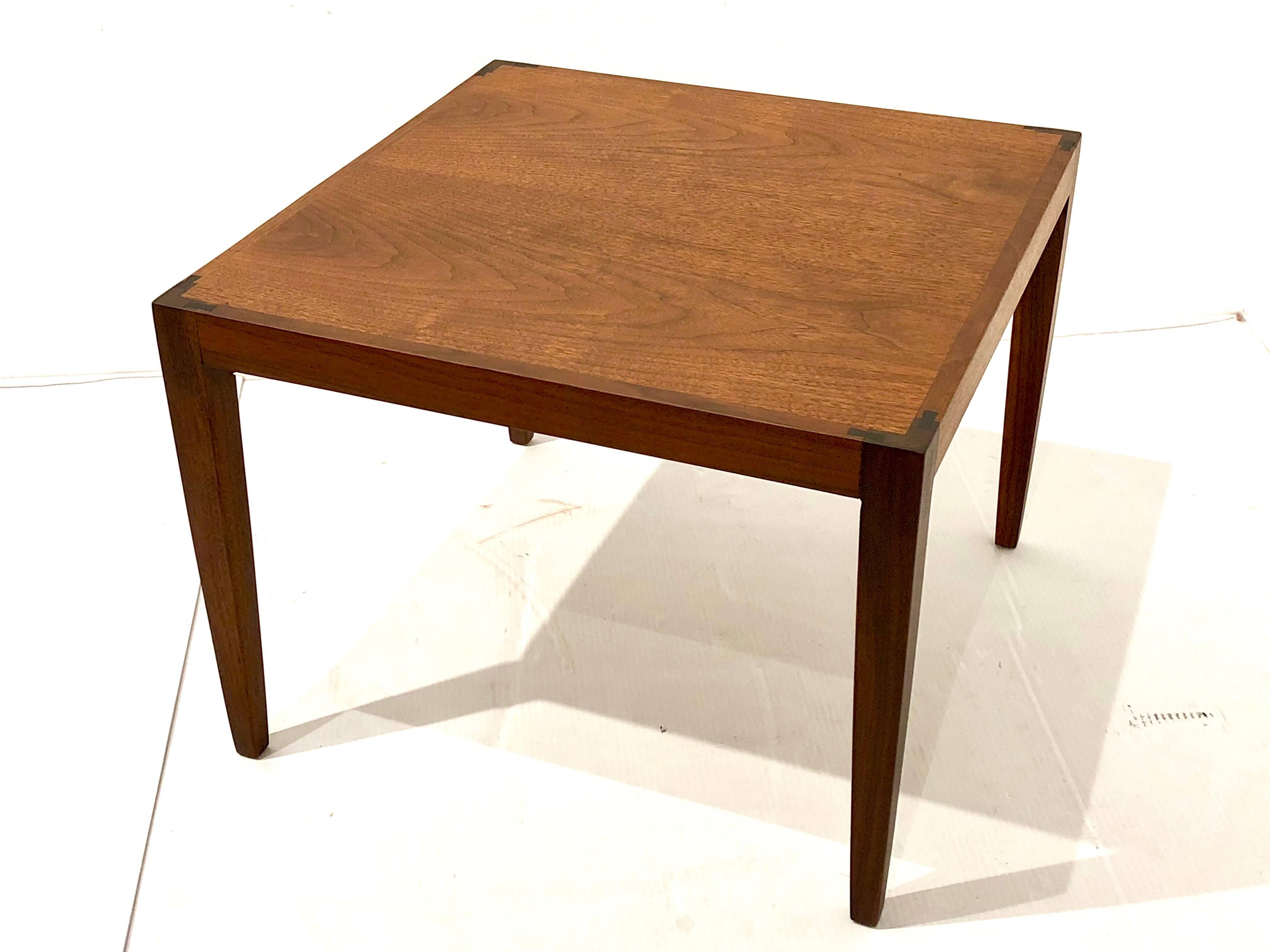 Exceptional small end table in teak with rosewood accents, freshly refinished , and in credible craftsmanship solid and sturdy.
