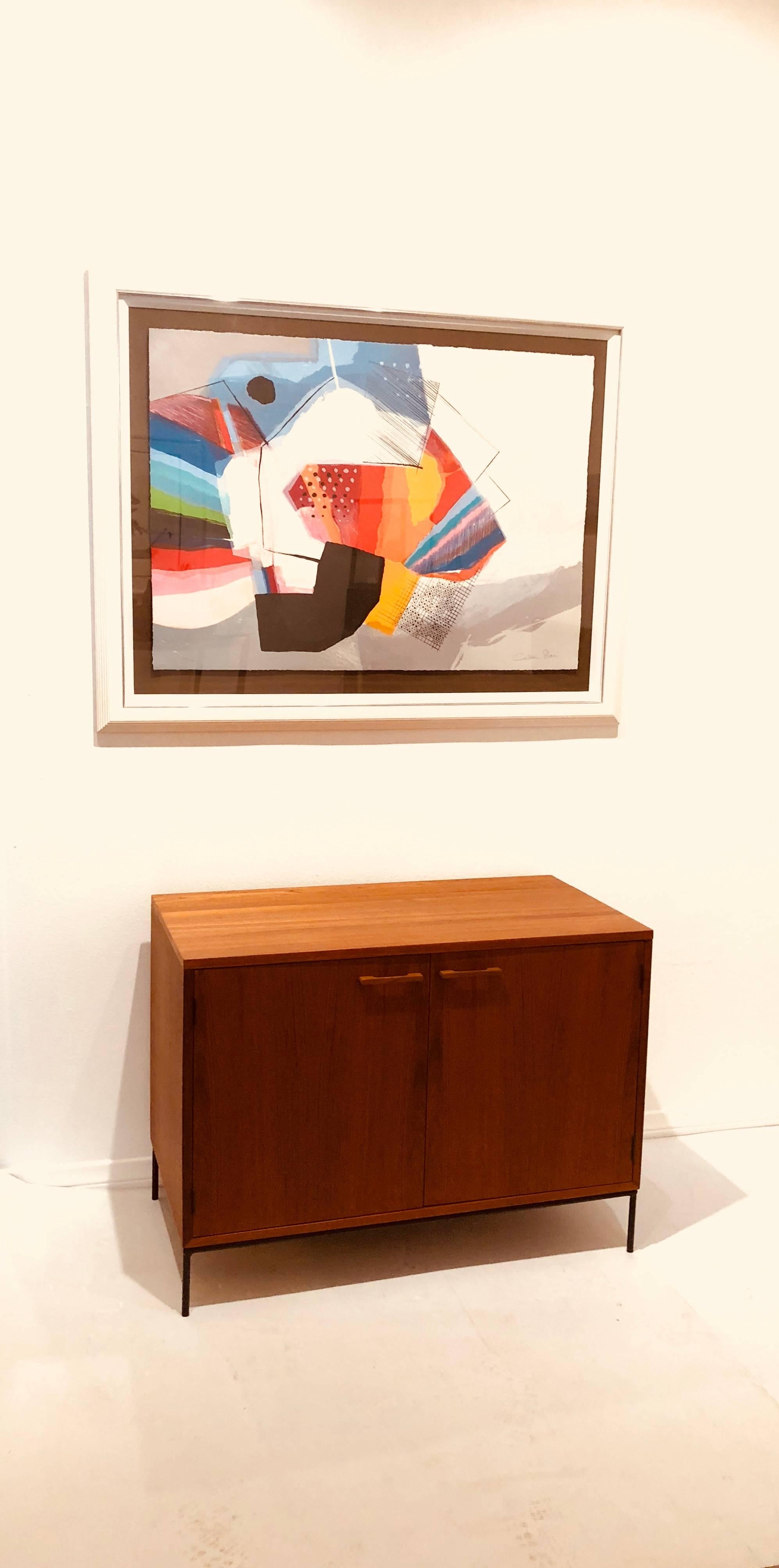 Simple elegant double-door mini stereo cabinet, in teak freshly refinished the top lifts for playing records and has a shelf and good storage.