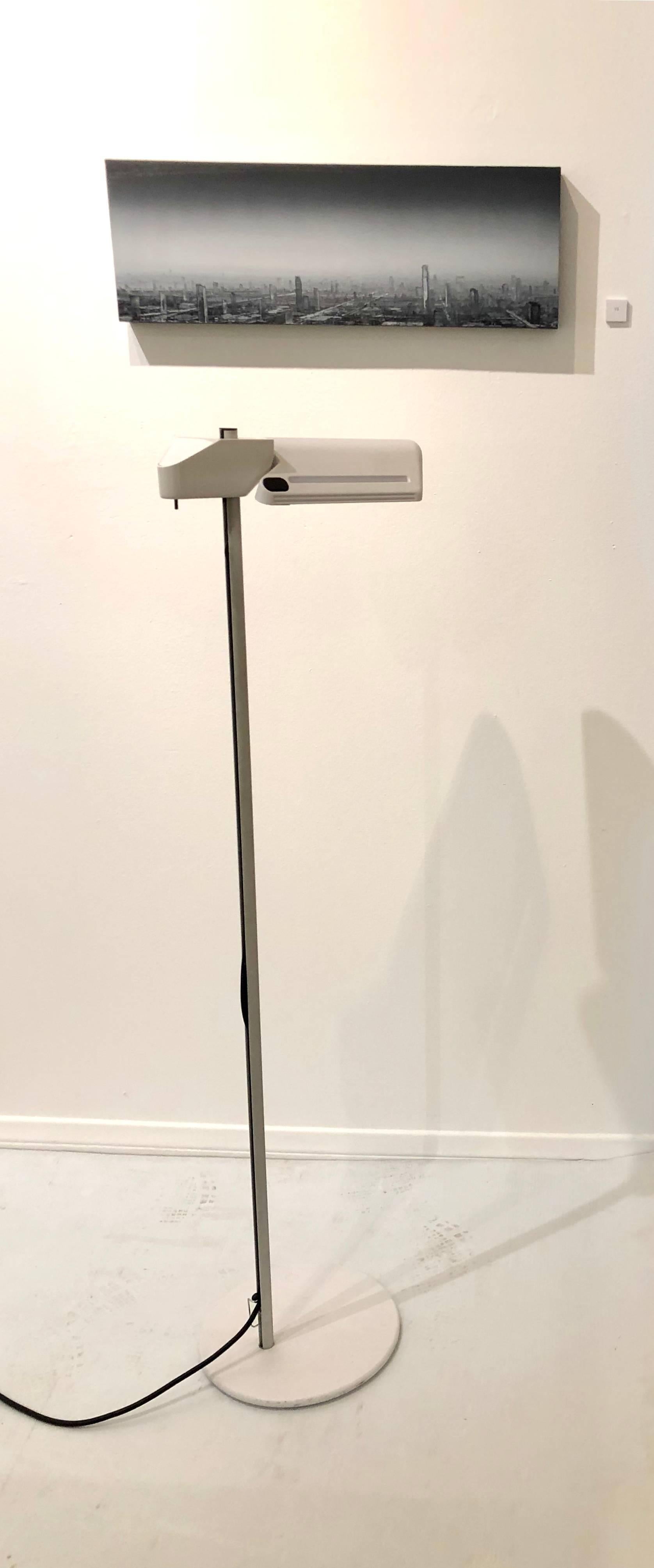 Beautiful design on this Memphis style floor lamp designed by Bruno Gecchelin, for Arteluce the shade goes up and down, and has a push off/on switch with dimmer .and the shade rotates to light a spot.