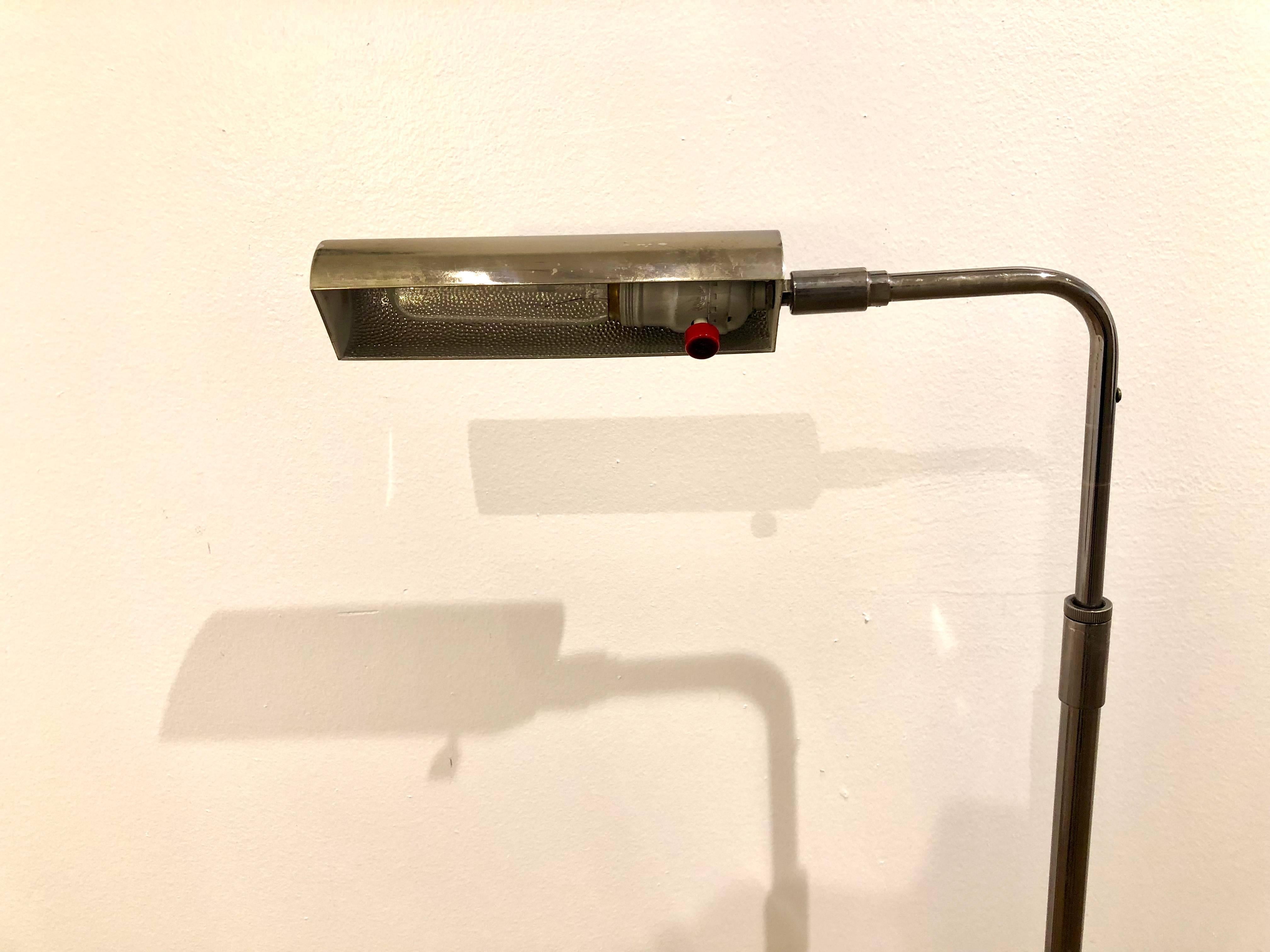 Fine chrome pharmacy lamp by Koch & Lowy. The lamp is height adjustable and swivel. The shade is also four-way adjustable. With dimmer switch and bakelite, a rare early production piece the chrome finish shows natural wear due to age, measure: base