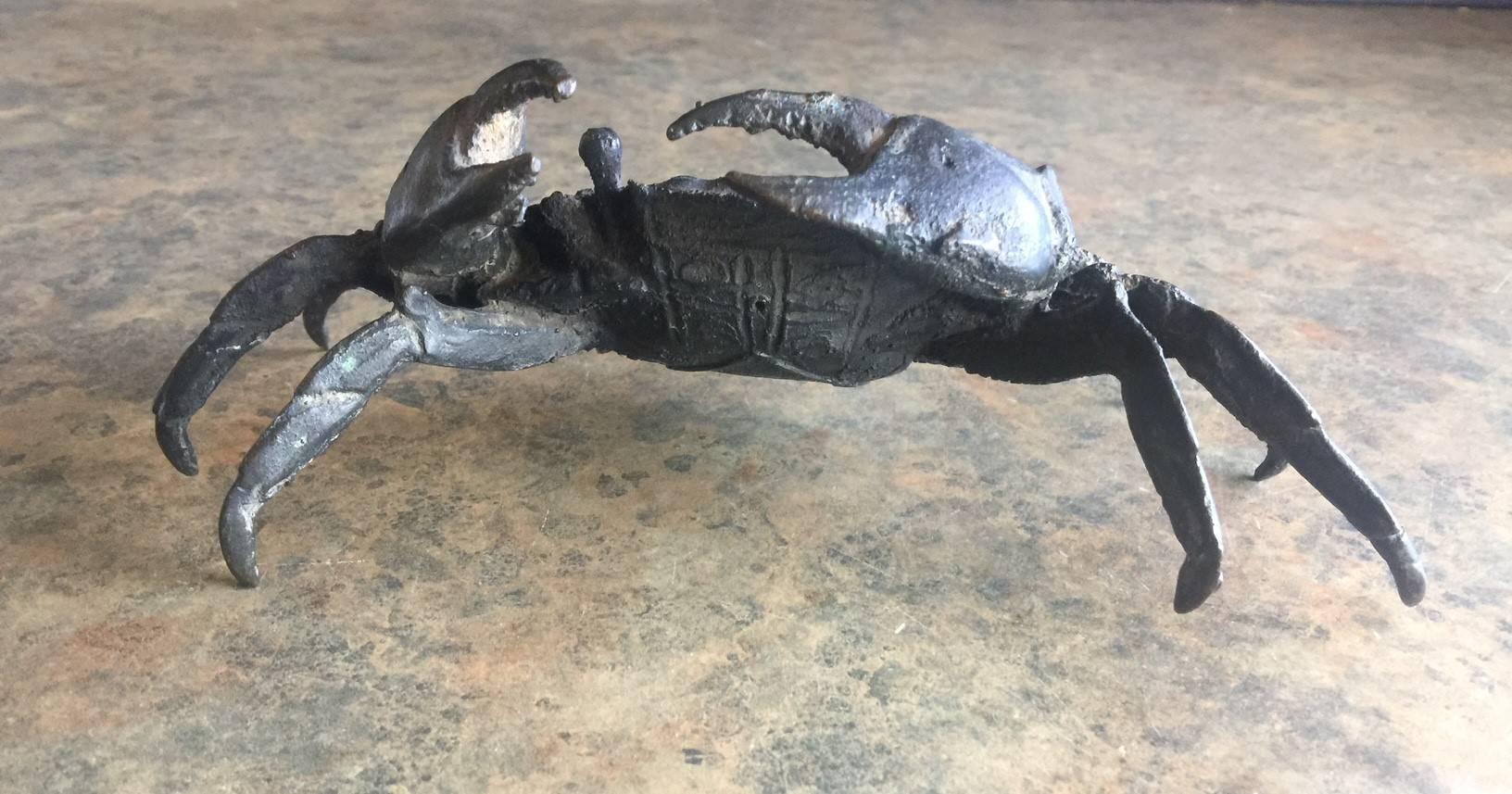 A well detailed and patinated articulated bronze crab sculpture. The piece has an Asian flair to it and may be vintage Chinese.