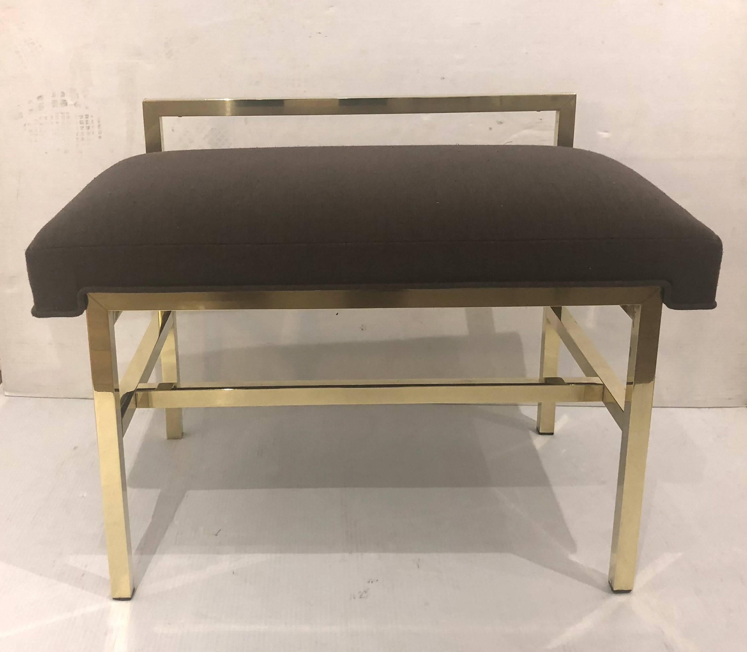 Elegant and rare bench in the style of Dunbar freshly polished brass pipping frame, and new upholstered seat in Knoll fabric, solid and sturdy excellent quality.