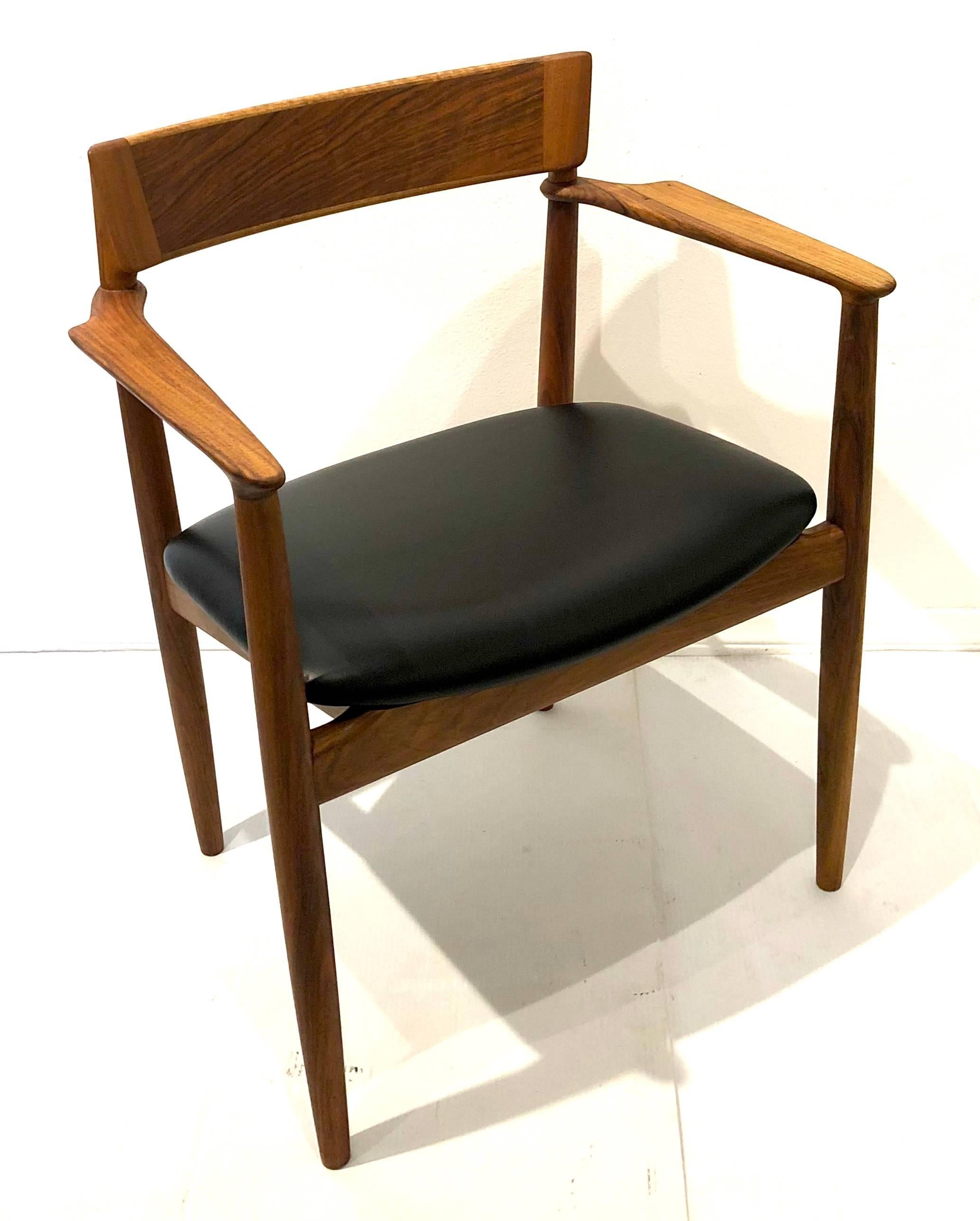A beautiful sculpted arms rosewood and light walnut rare armchair, freshly refinished and new black leather upholstered seat. Excellent condition solid and sturdy.