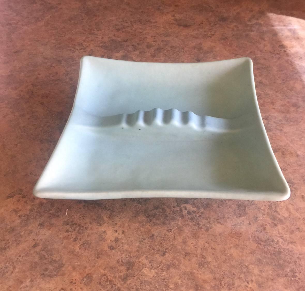 Very nice ming blue art pottery footed ashtray by Van Briggle of Colorado Springs, CO., circa 1930s. The piece is signed on the underside and is in excellent condition with no chips or cracks.