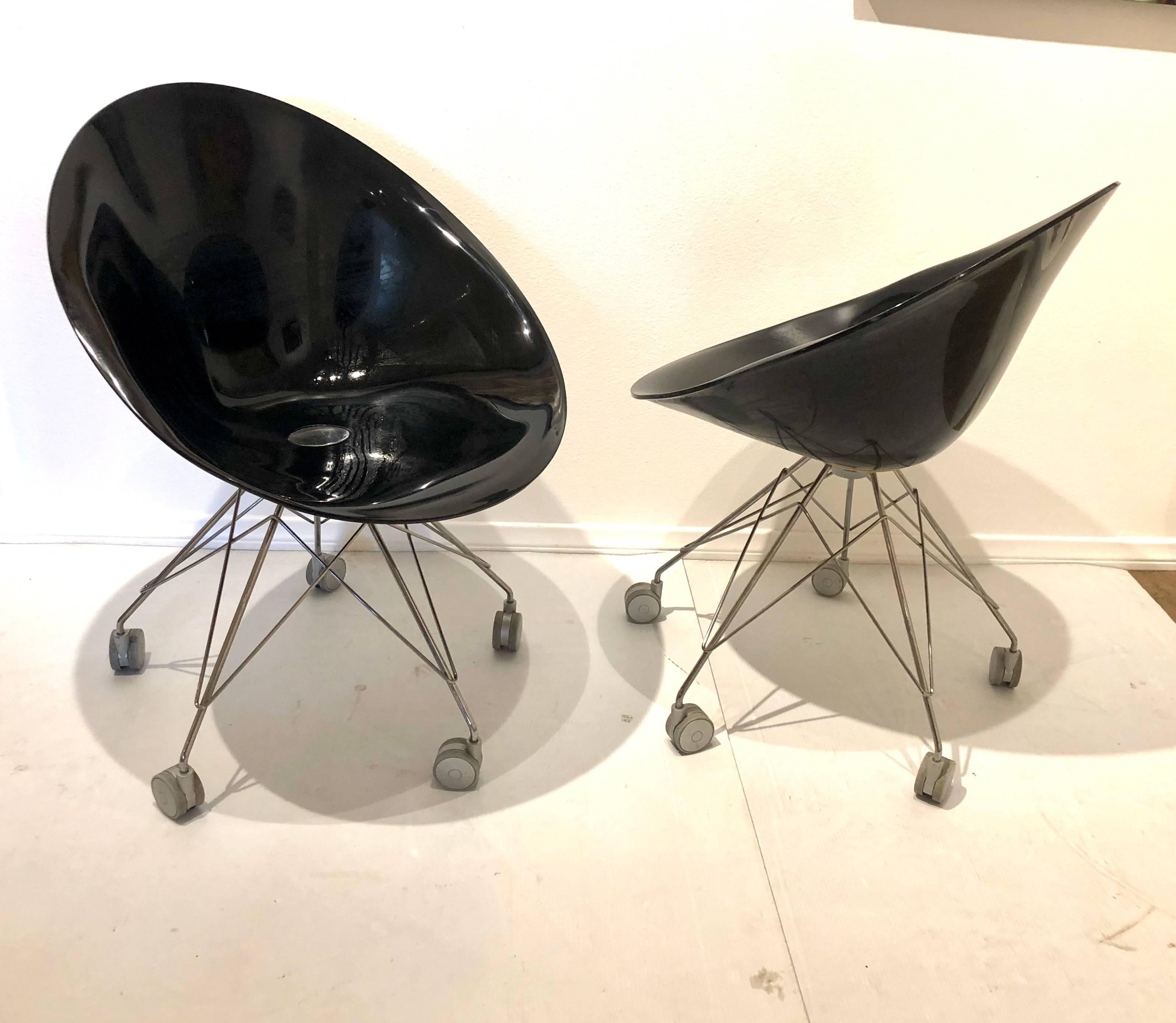 Cool pair of black Eros chairs on casters designed by Phillippe Starck, for Kartell in black Polycarbonate and chrome base, nice clean condition.