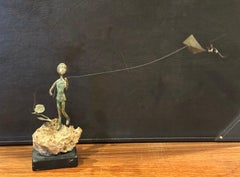Child Flying Kite Bronze on Volcanic Rock Sculpture by Malcolm Moran
