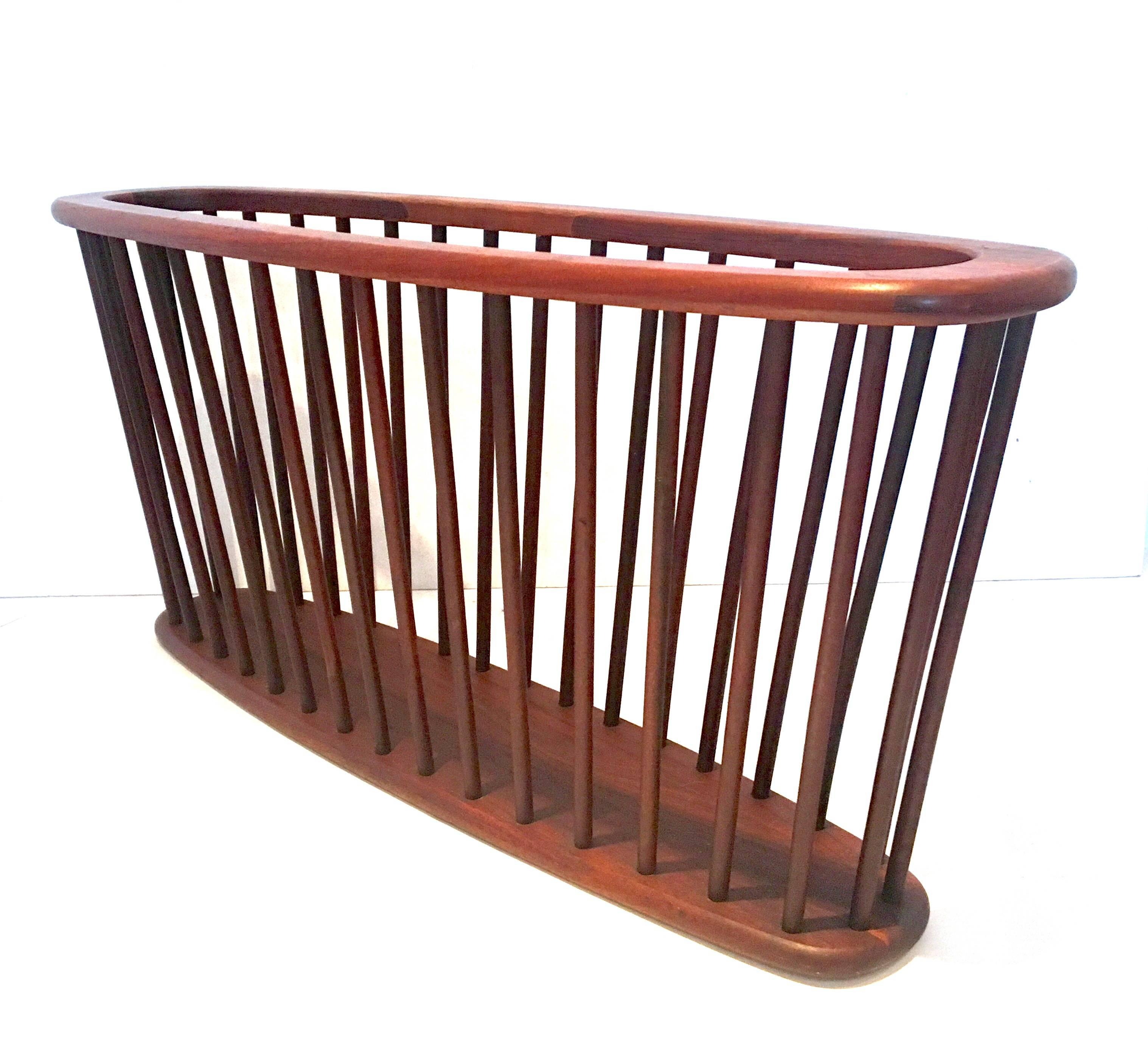 Midcentury solid walnut X large magazine rack by Arthur Umanoff, circa 1950s. Great California design in very good vintage condition.