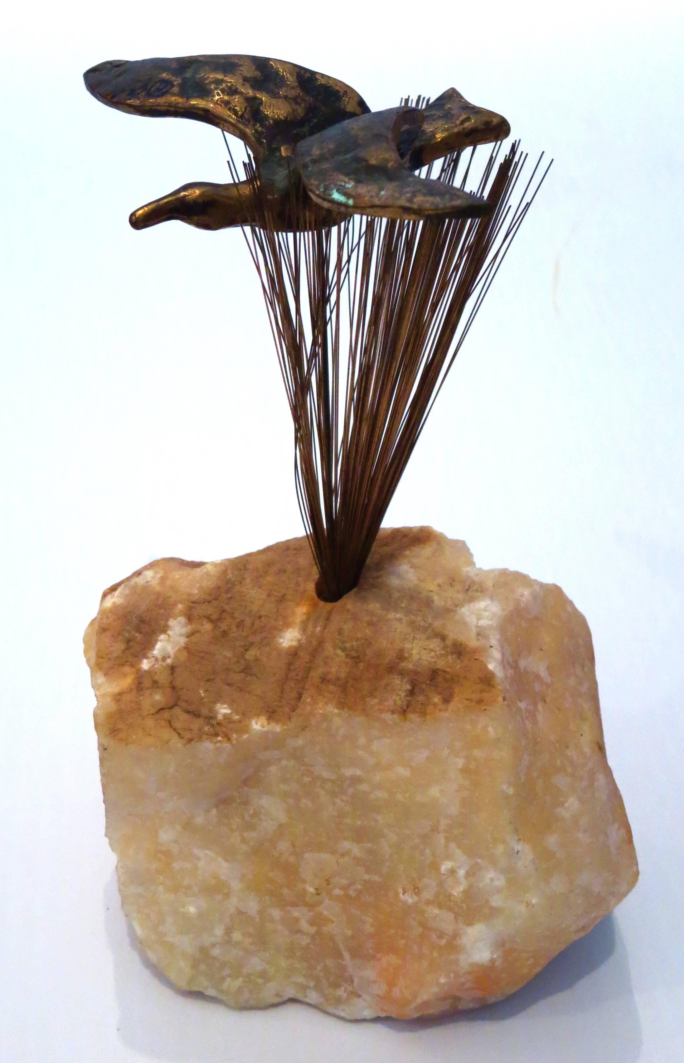 Rare studio Jere signed bronze table sculpture, by curtis Jere , sirca 1970s sitting on a raw marble stone base , well made and beautifull to look at it.