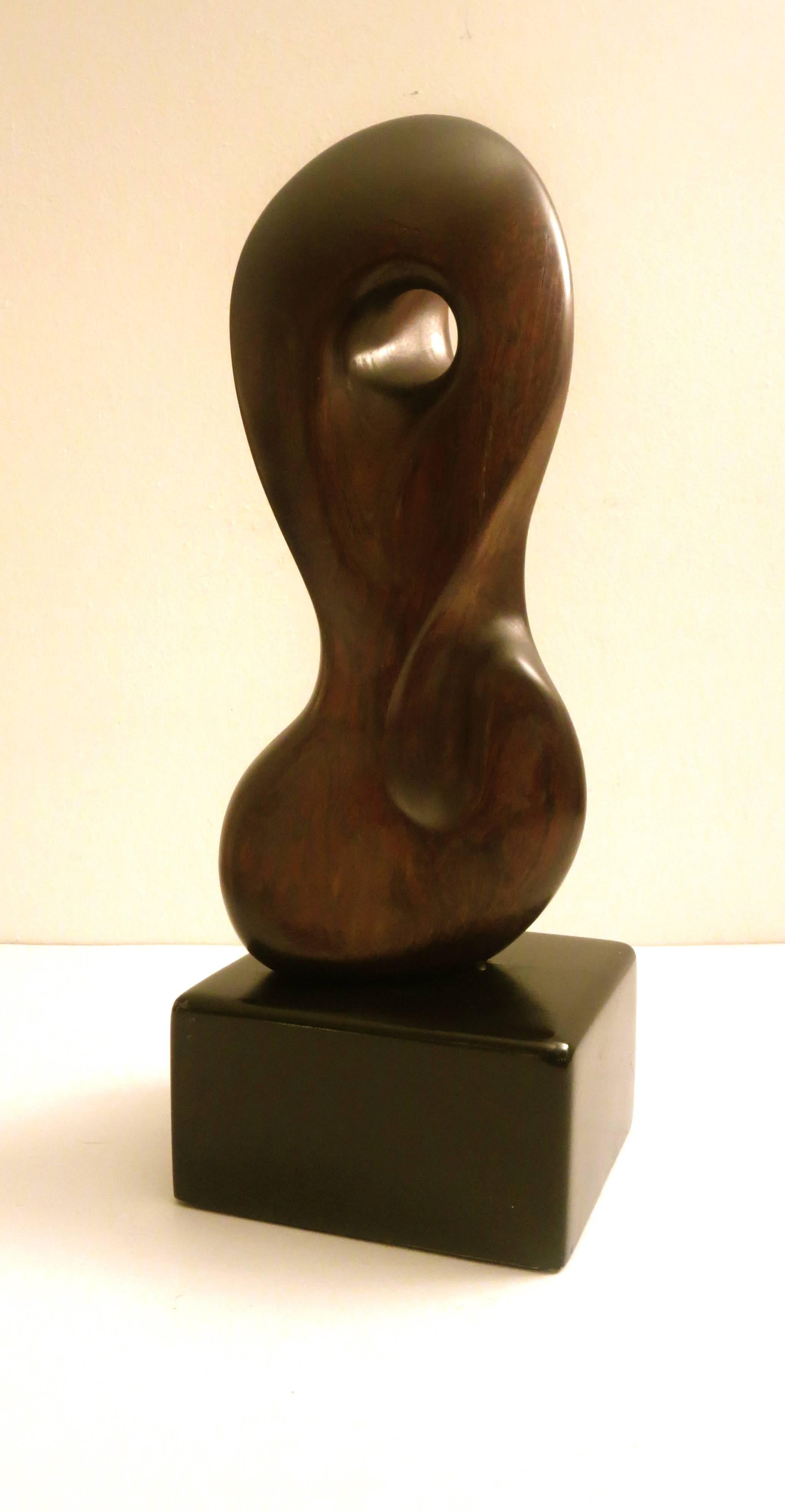 Incredible one of a kind biomorphic sculpture by California listed artist Jocko Johnson, sculpted ironwood free-form on back lacquer solid wood black base, beautiful shape in its original condition and patina, comes from a local state where the