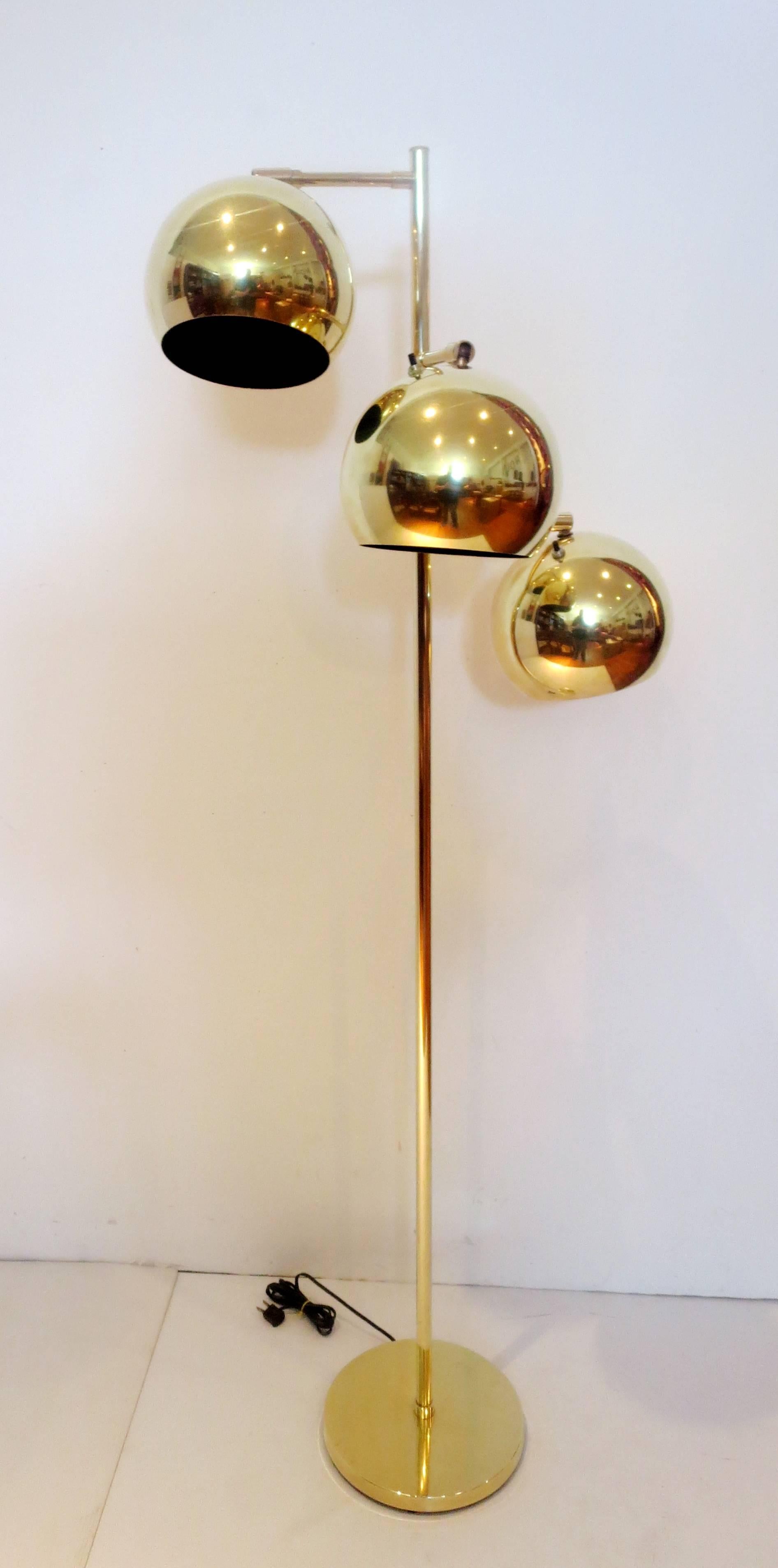 Striking polished brass multidirectional three spheres balls, each shade has and a separate switch for each lamp, and a 7