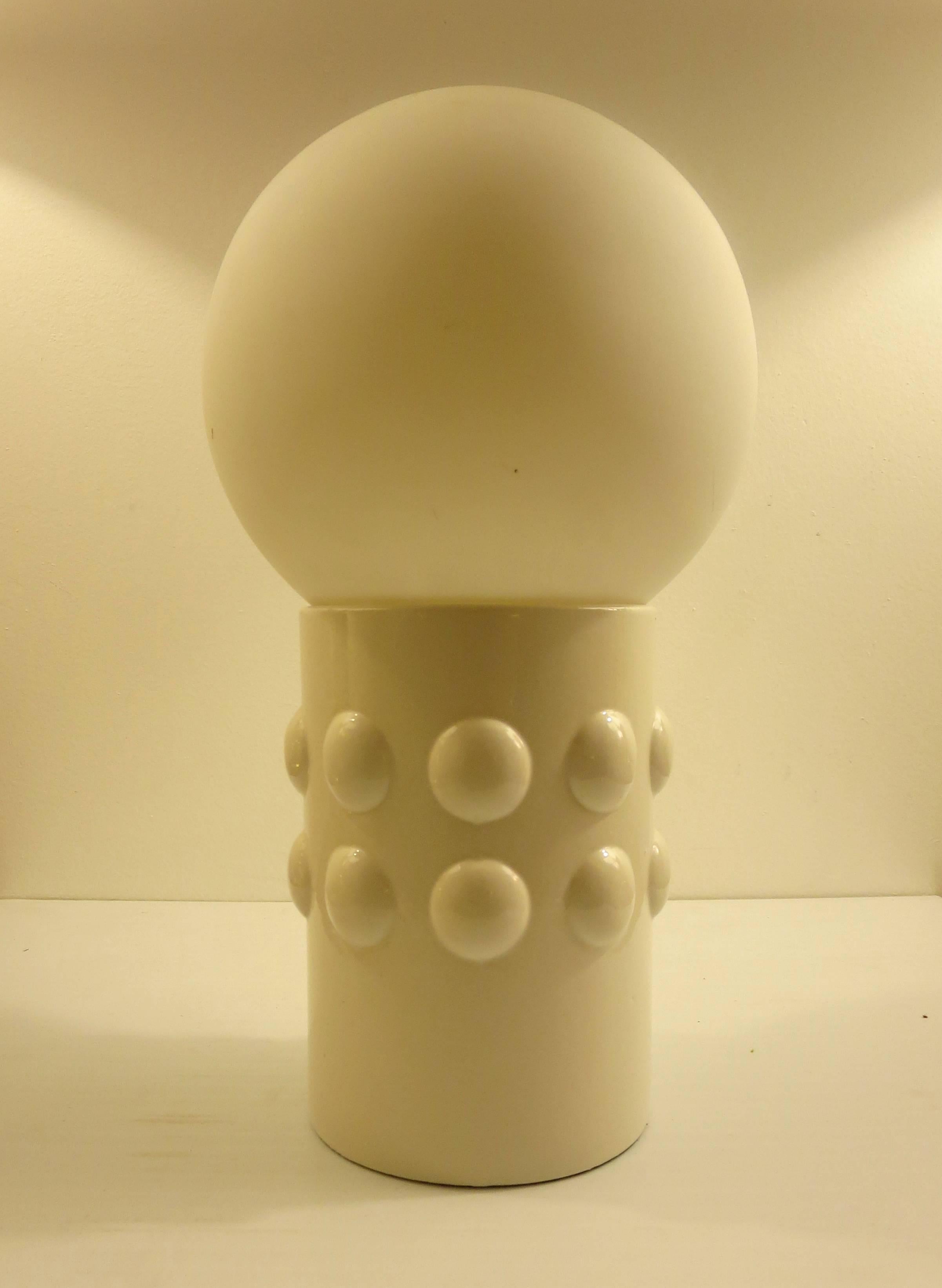 Great and simple design on this Italian ceramic white gloss base on frosted glass ball shade, circa 1970s, great Iconic pop space age piece, excellent condition beautiful glow when its lighted.