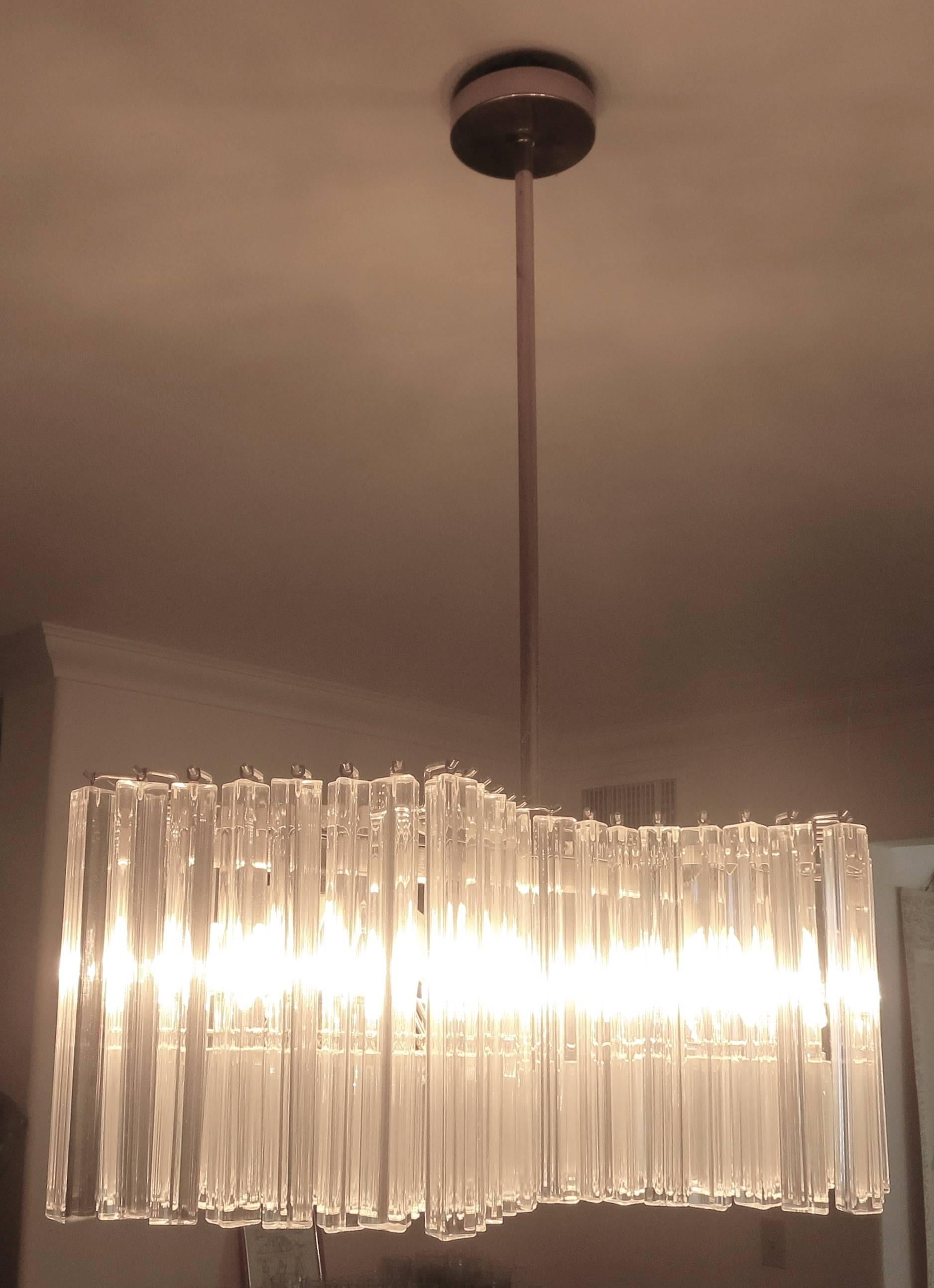 Venini chandelier, with Trilobi glass, Italy, circa 1970s, double rhombus shape with short and tall glass pendants, Murano triedri prism glass Italy with brass and steel frame, great and unique shape.