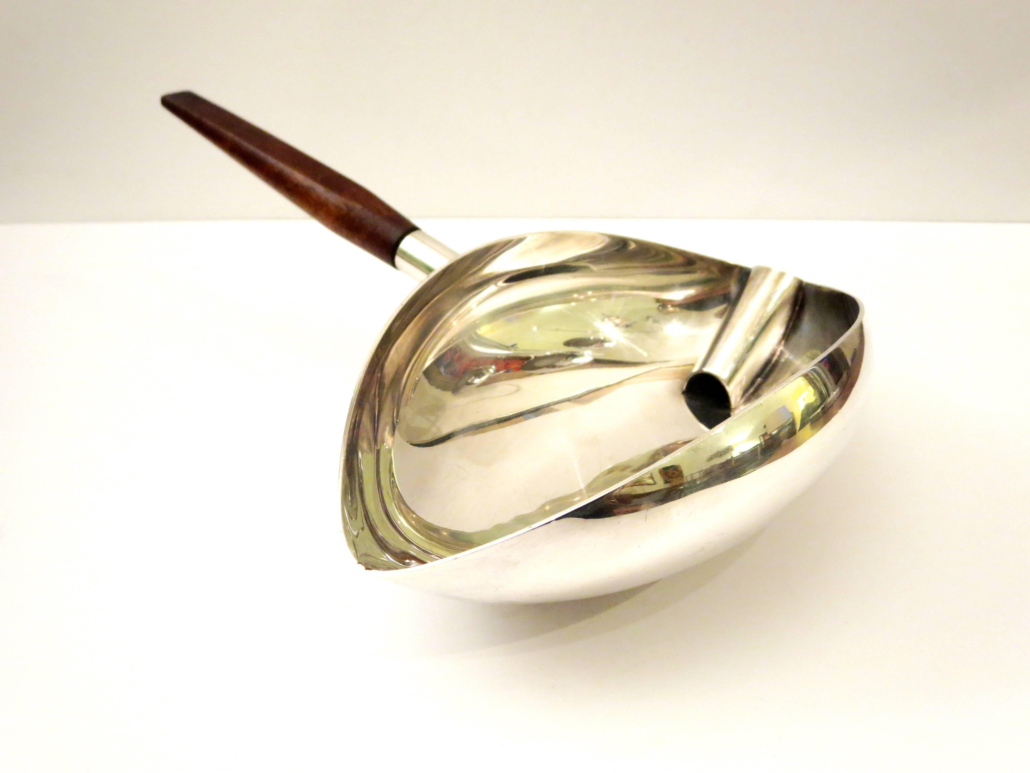 Beautiful design on this rare gravy boat designed by Lino Sabattini for Christofle , in silver plate finish with solid walnut handle, great design stamped on the side edge, can be used as a candy dish or just as a sauce boat.