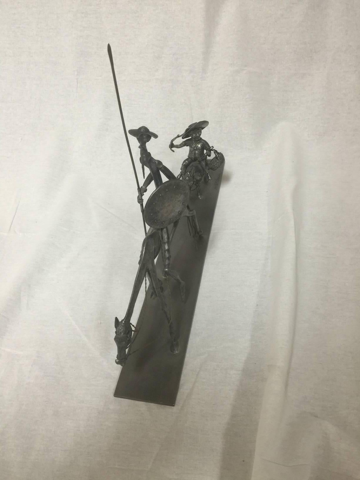 Wonderful pewter (etain fin) sculpture of Don Quixote on horseback followed by Sancho Panza by noted French sculptor Michel Laude. The piece is highly detailed and measures 17
