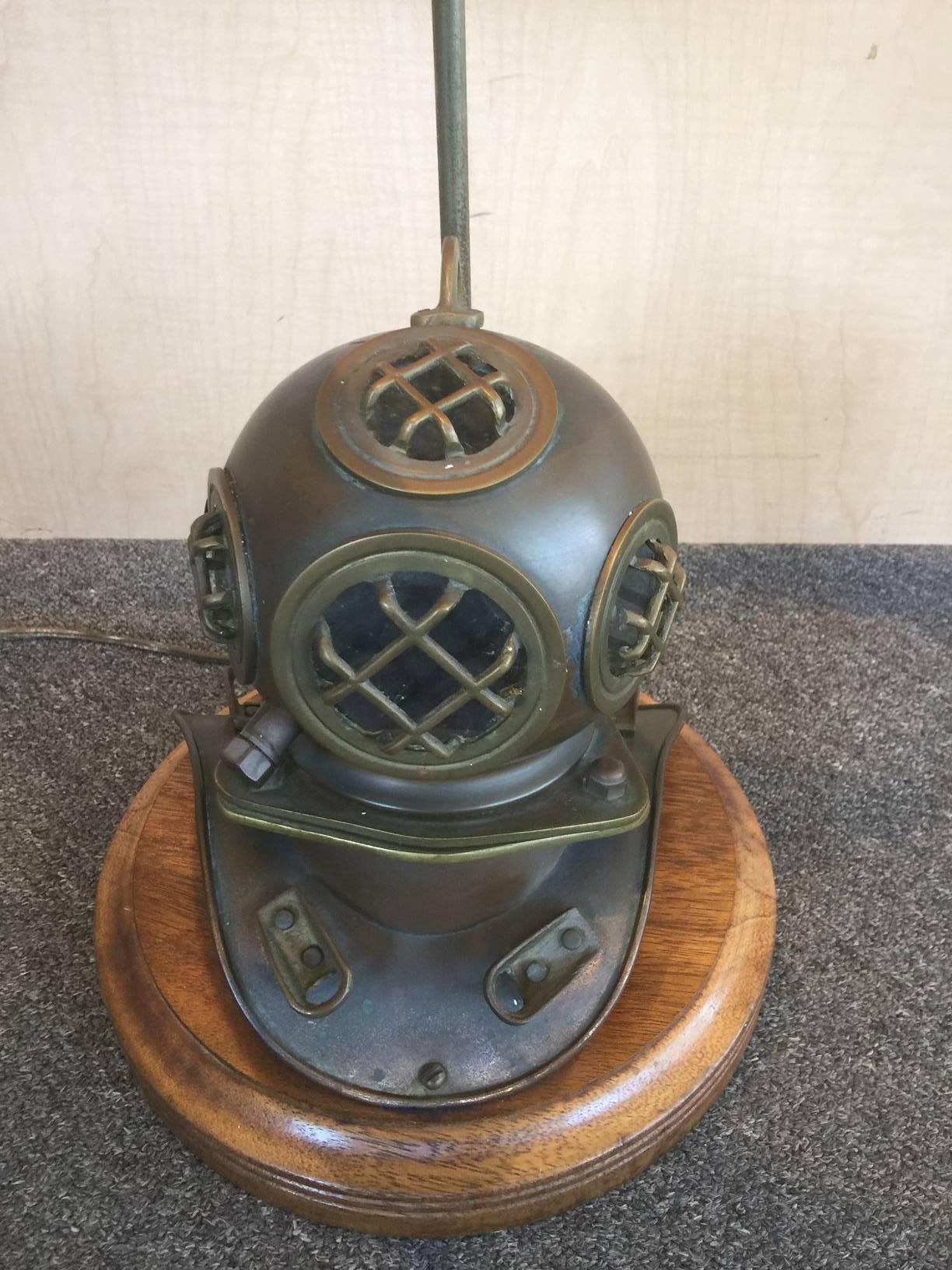 Very eclectic vintage nautical lamp with a brass divers helmet as the centerpiece. Helmet sits on a 12