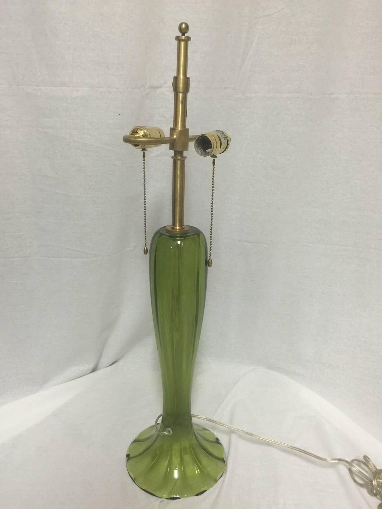 A simply gorgeous pair of Murano art glass trumpet lamps in a vibrant candy apple green. The lamps are quite tall, slender and ribbed lamp with a splayed foot. Shades are not included.