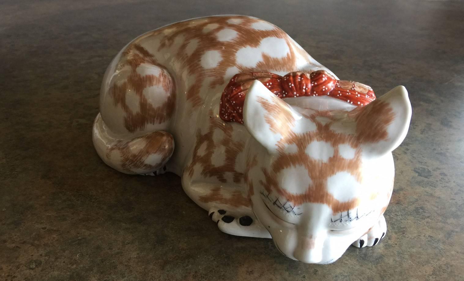 Excellent Kutani porcelain piece from the Meiji period (late 1800s). Sleeping cat is in excellent condition and measures 10