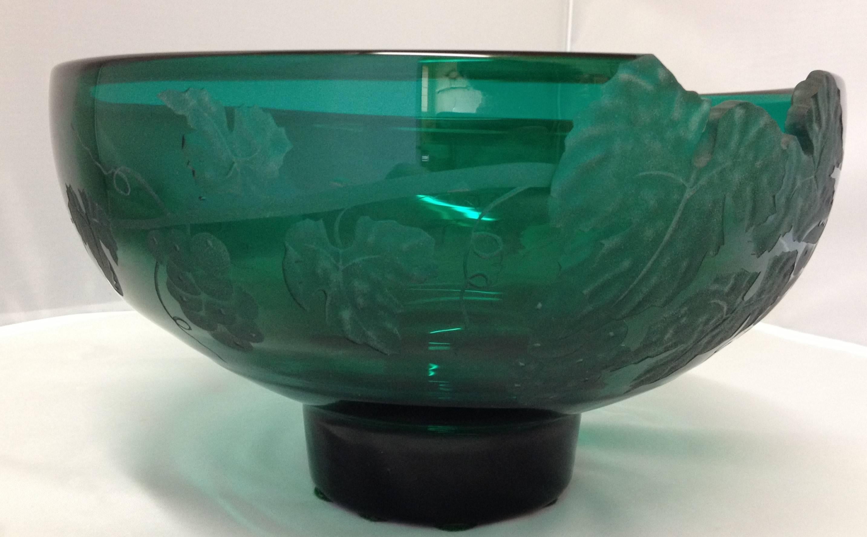 Absolutely gorgeous sand carved art glass bowl by California artist Cynthia Myers. The bowl is an emerald green handblown piece which is individually drawn, sandblasted and signed and dated. The grapes on the vine motif are hand etched with