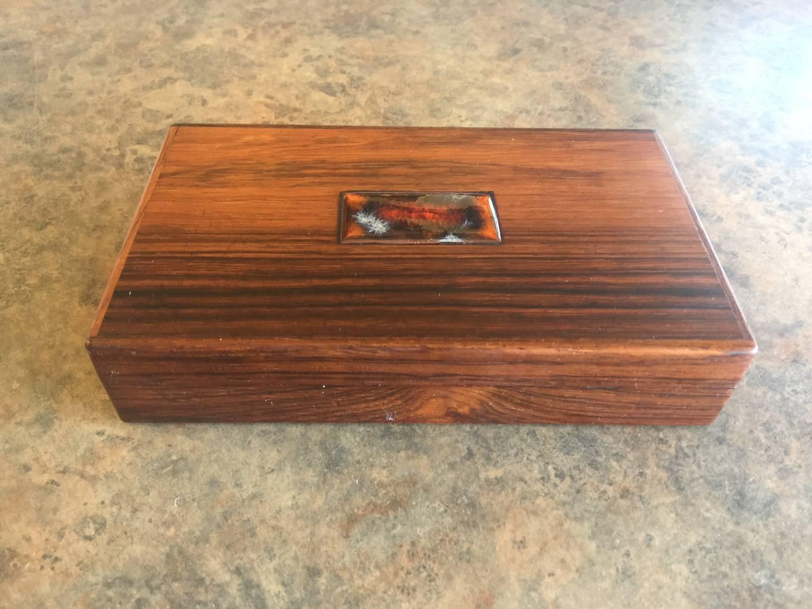 Beautifully crafted solid rosewood trinket box / humidor with divider by Danish craftsman Alfred Klitgaard. This pieces was produced in the late 1950s-early 1960s. The construction is very high quality with a gorgeous Bodil Eje orange ceramic tile