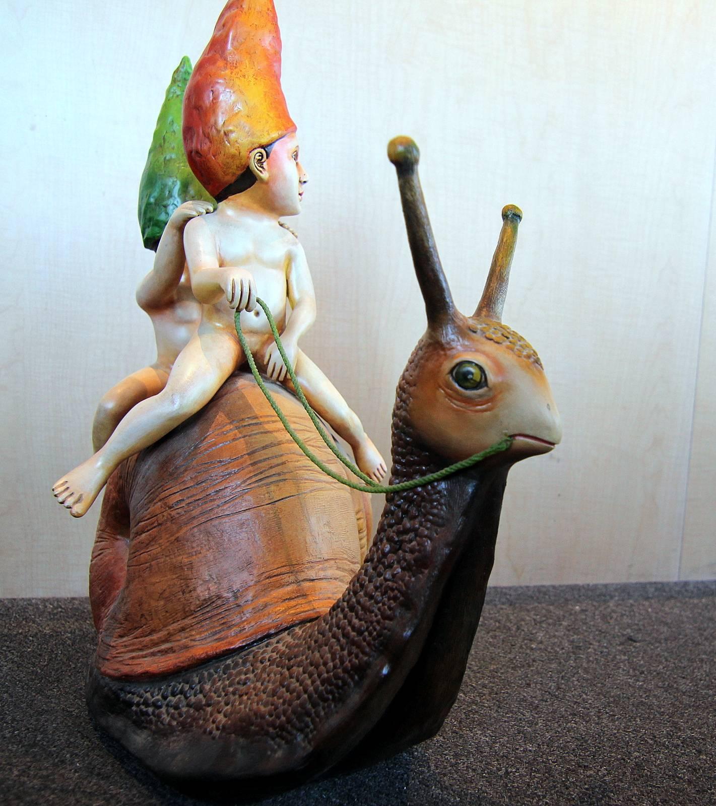 Resin sculpture of a two young boys riding a snail by Mexican artist Sergio Bustamante. The piece is hand signed and numbered 2/100 and was made in the mid-1980s. Great color and detail!