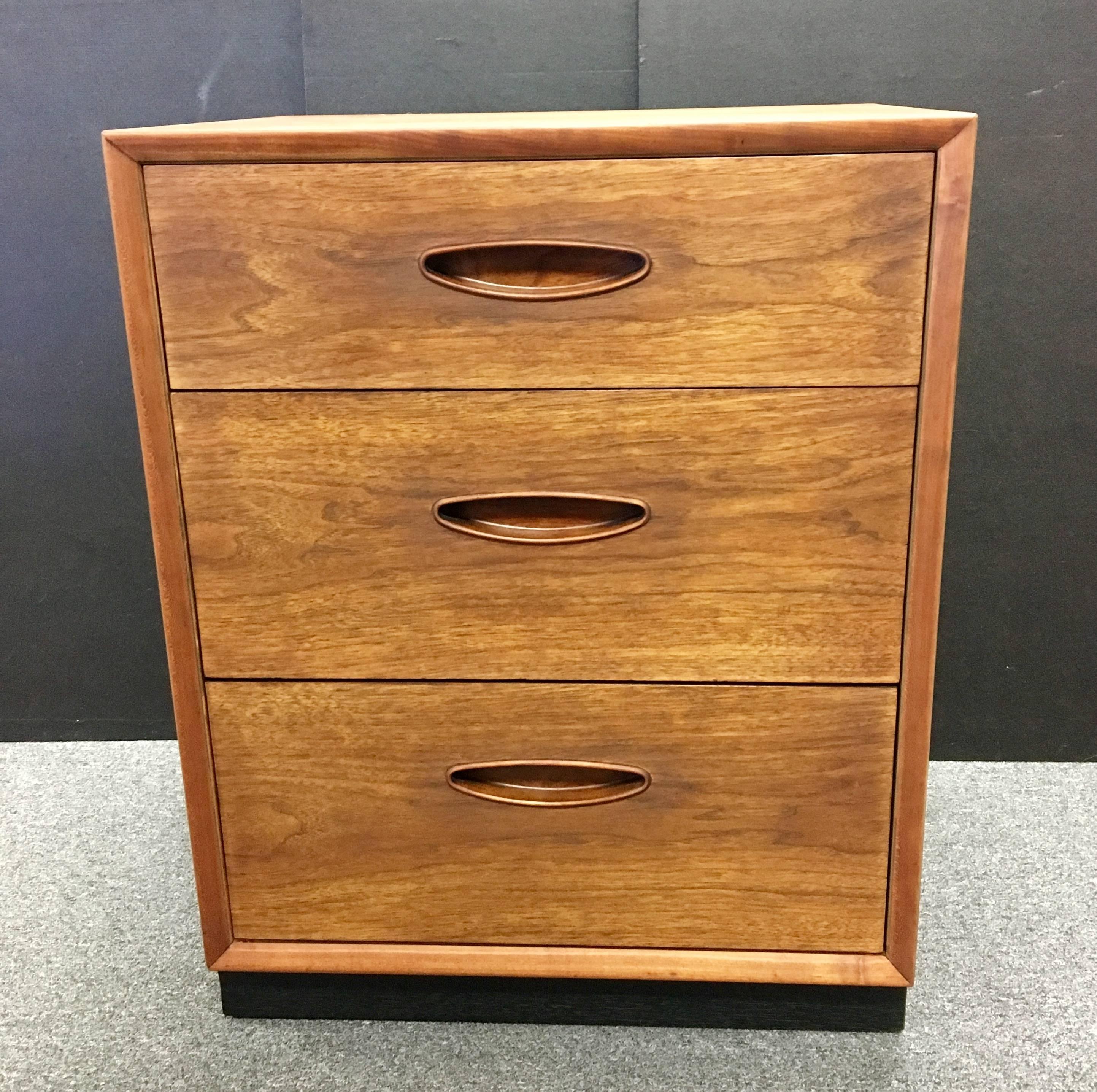 Beautiful pair of Mid-Century Modern, American walnut triple drawer nightstands By Heritage Henredon, freshly refinished and finished with hand rubbed oil finish, high quality and great condition.