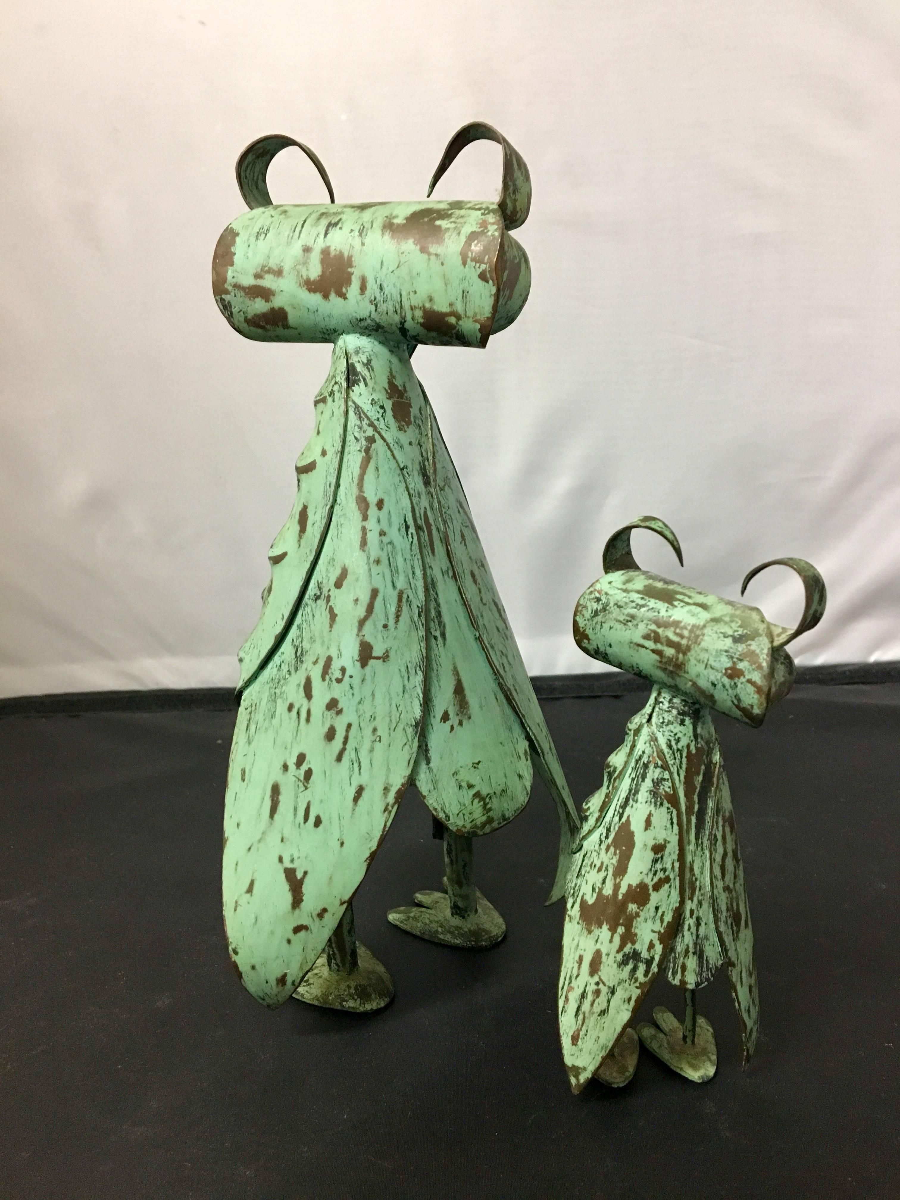 Eclectic pair Mid-Century, patinated copper, hand-hammered owl sculptures by Mexican artisans Los Castillo. Signed and stamped, circa 1950s; one owl is 9" tall and the second is 5" tall. Excellent vintage condition with a great Verde
