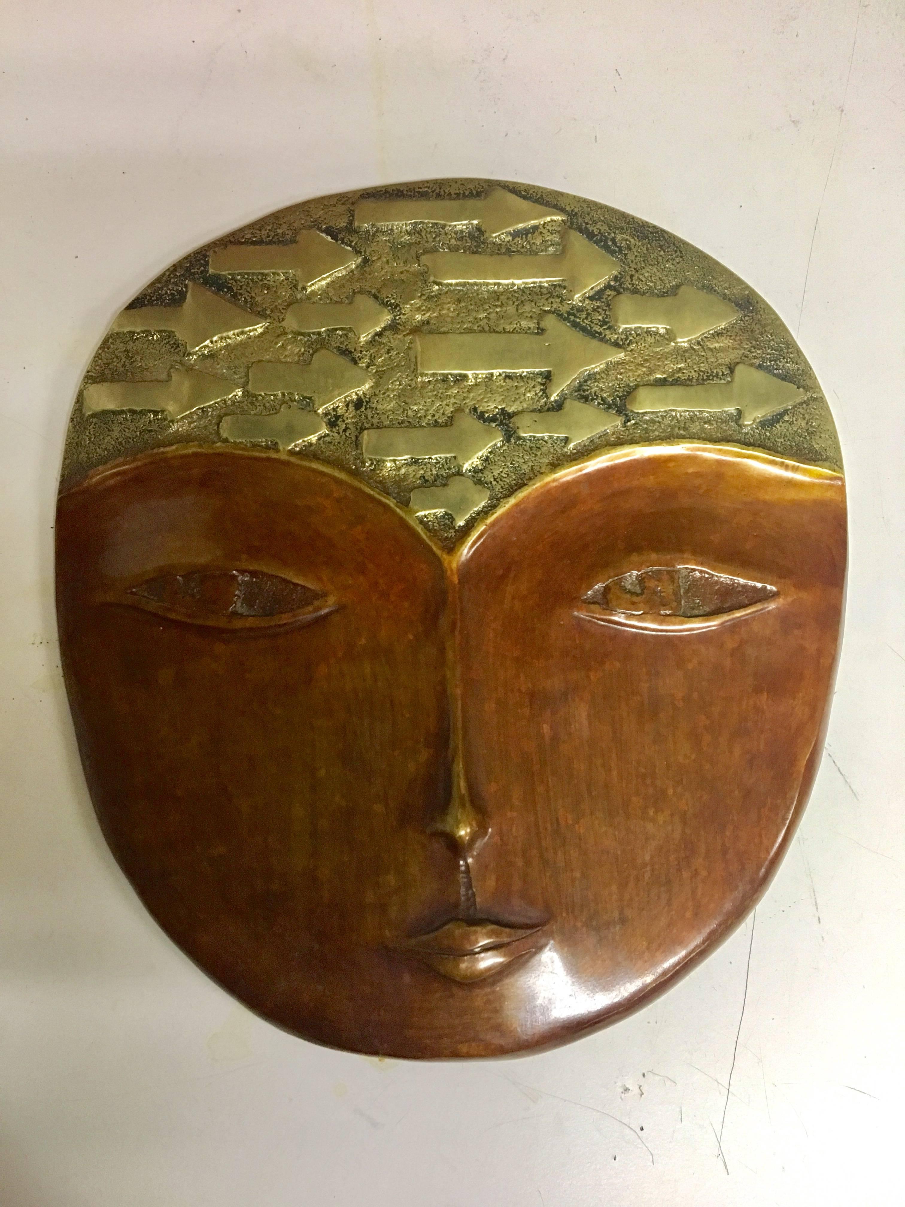 Contemporary artist face mask by Costa Rican artist A. M. Fage signed and dated (1992) in solid bronze. High quality, two-toned piece.
