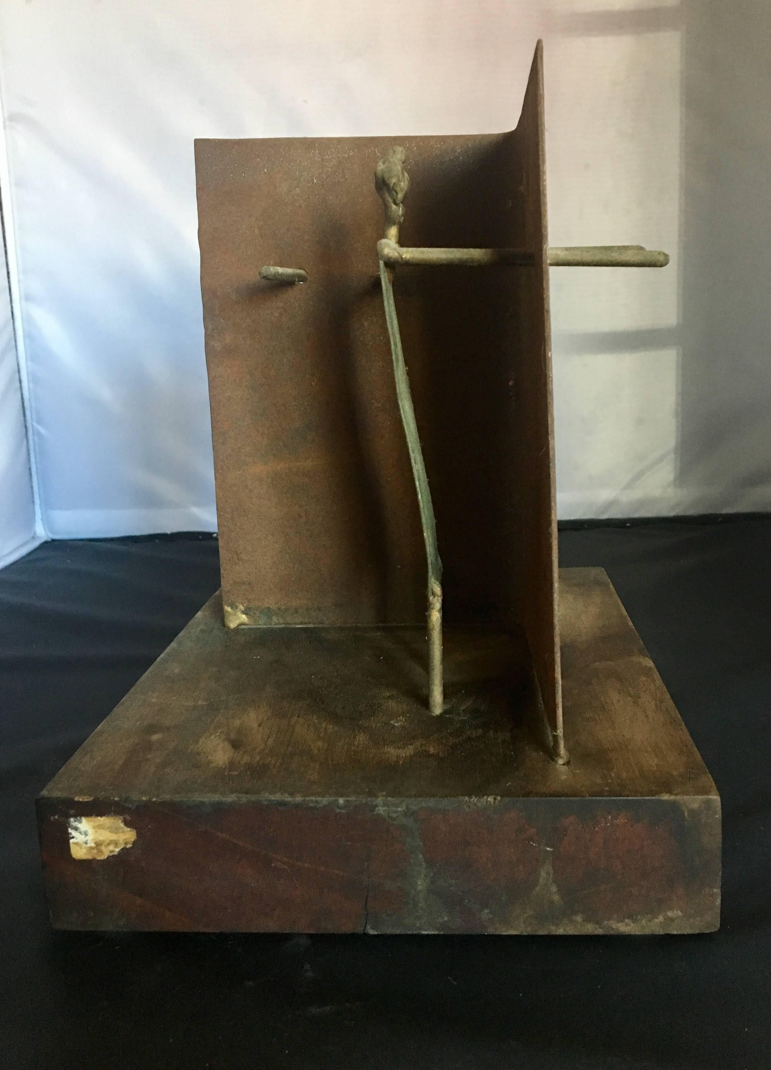 Interesting small abstract sculpture by San Francisco artist Ken Vares, circa 1968. The piece, two raw metal figures walled apart, sits on solid walnut base and is entitled "X-Y=0"; it is signed and dated. Wonderful original patina. The