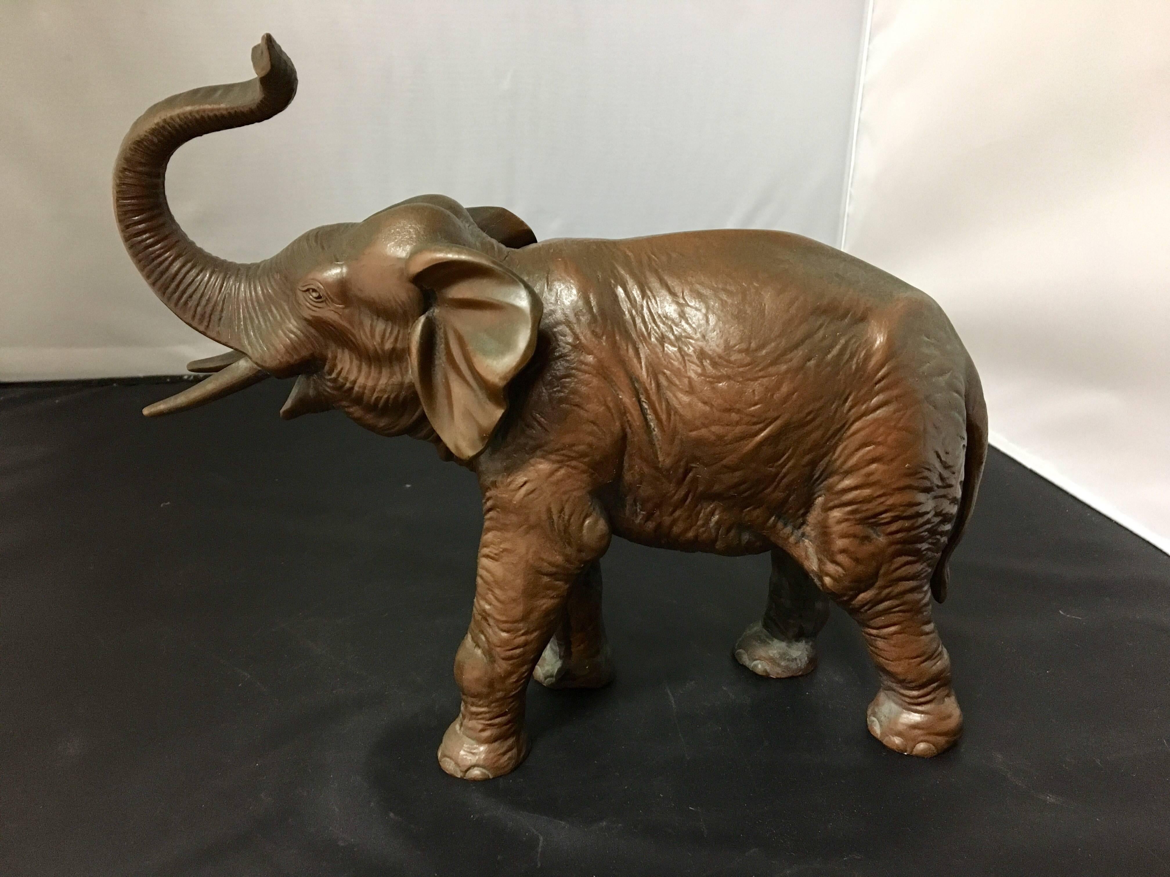 Well casted, heavy, bronze elephant in a copper finish. The piece is stamped 