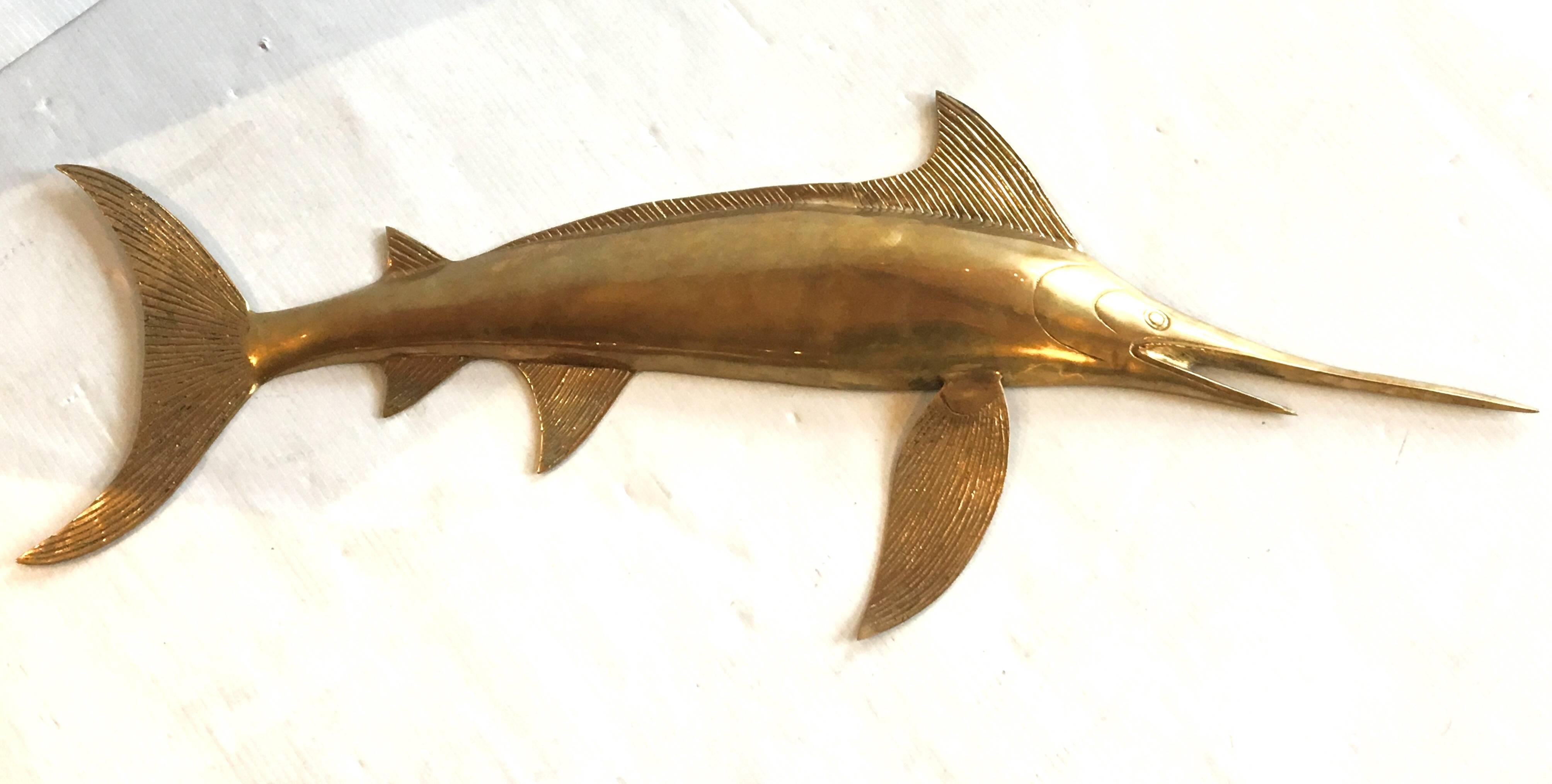 Nice elegant solid brass sailfish wall sculpture, circa 1980s easy to hang nice detail, polished brass.