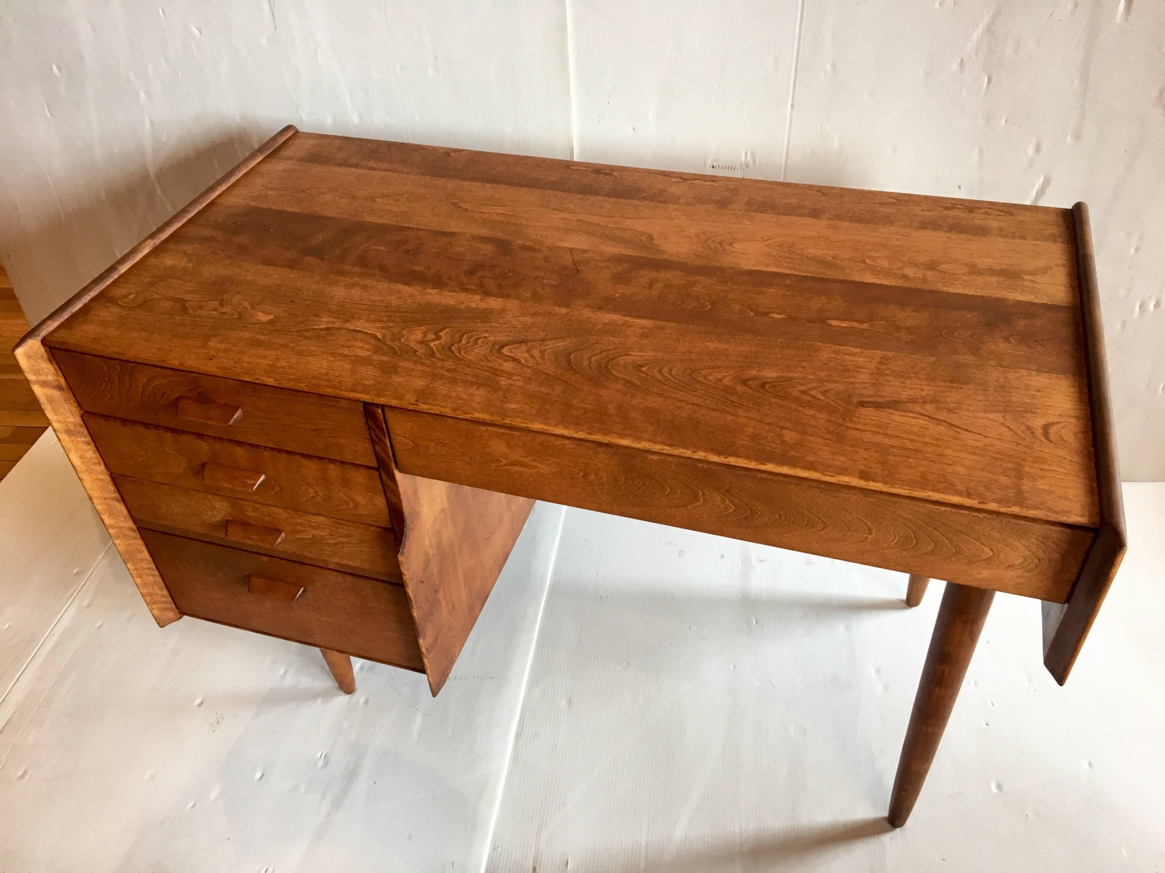 Solid walnut 1950s architectural desk, designed by Russel Wright for Conant Ball, very rare hard to come by only a few were produced, we refinished this one a couple of light blemishes here and there but overall very nice, solid and sturdy, three