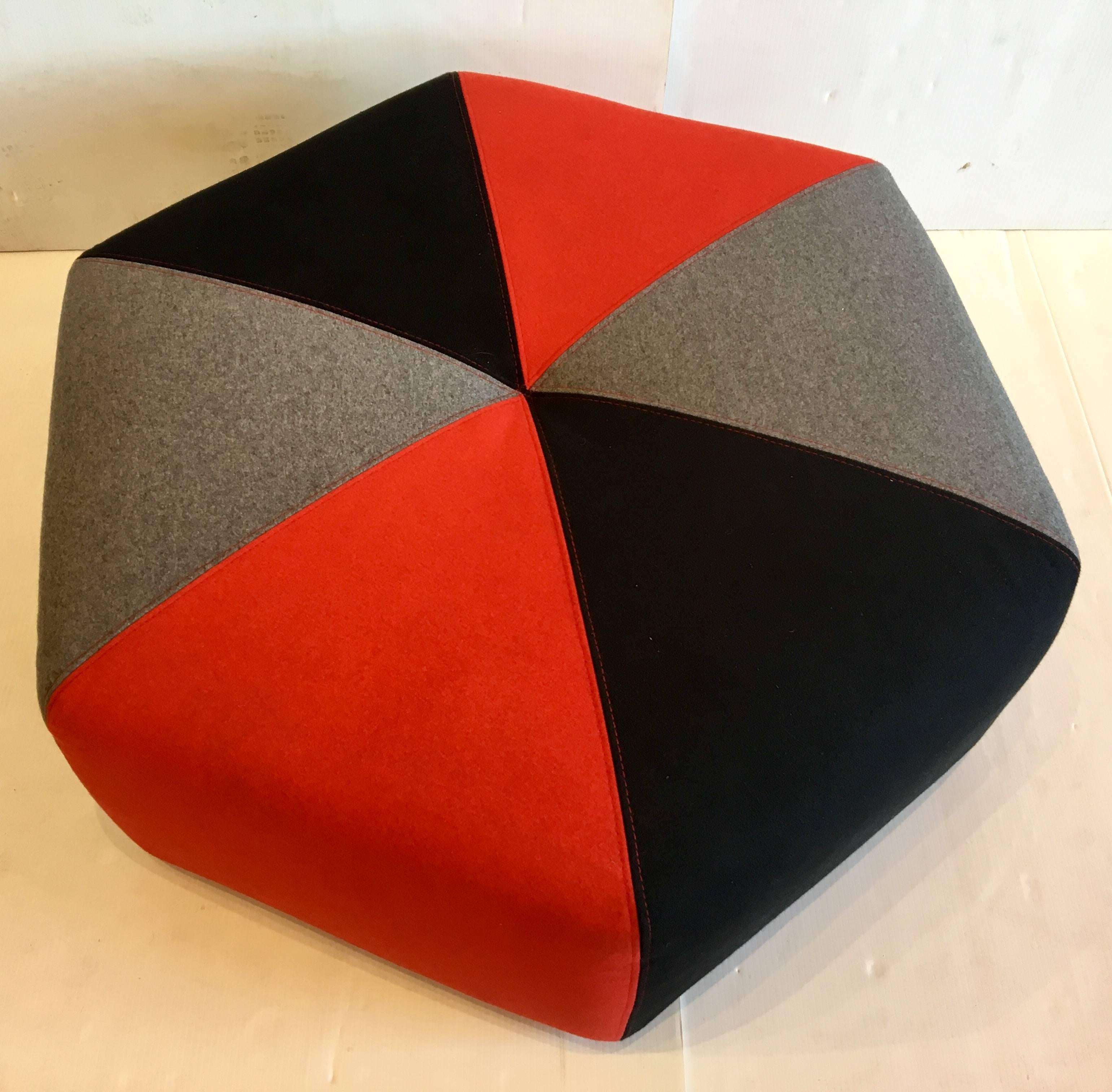 Cool upholstered low ottoman in colors, nice felt material like new condition Made in Denmark. great as a coffee table or for a kids room.