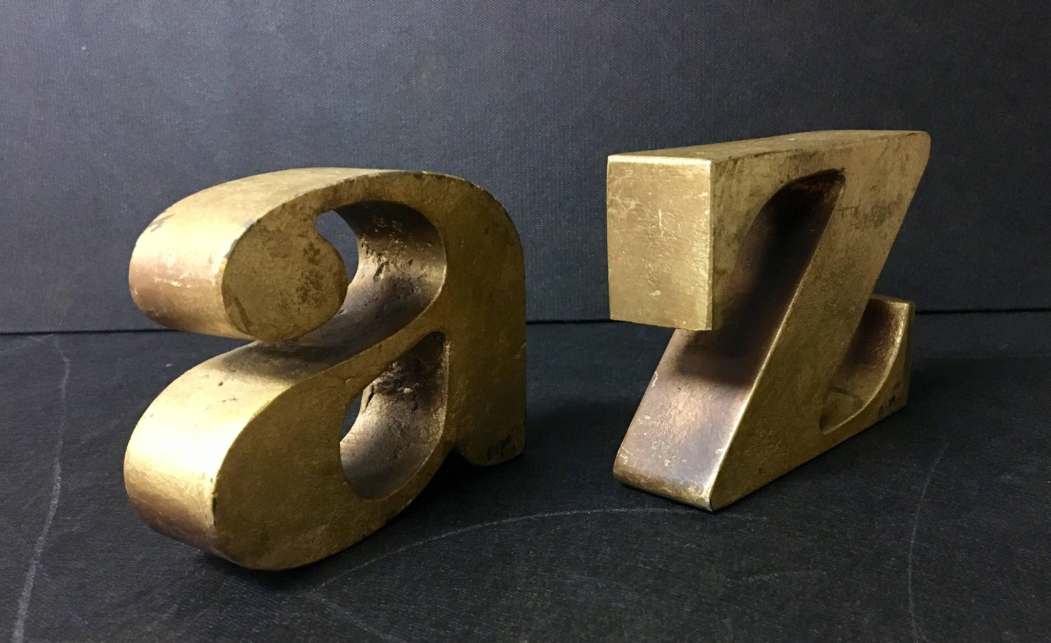 Excellent pair of Mid-Century, solid iron, "A to Z" bookends with gold leaf finish by Curtis Jere signed and dated "1968". Great patina in original condition.