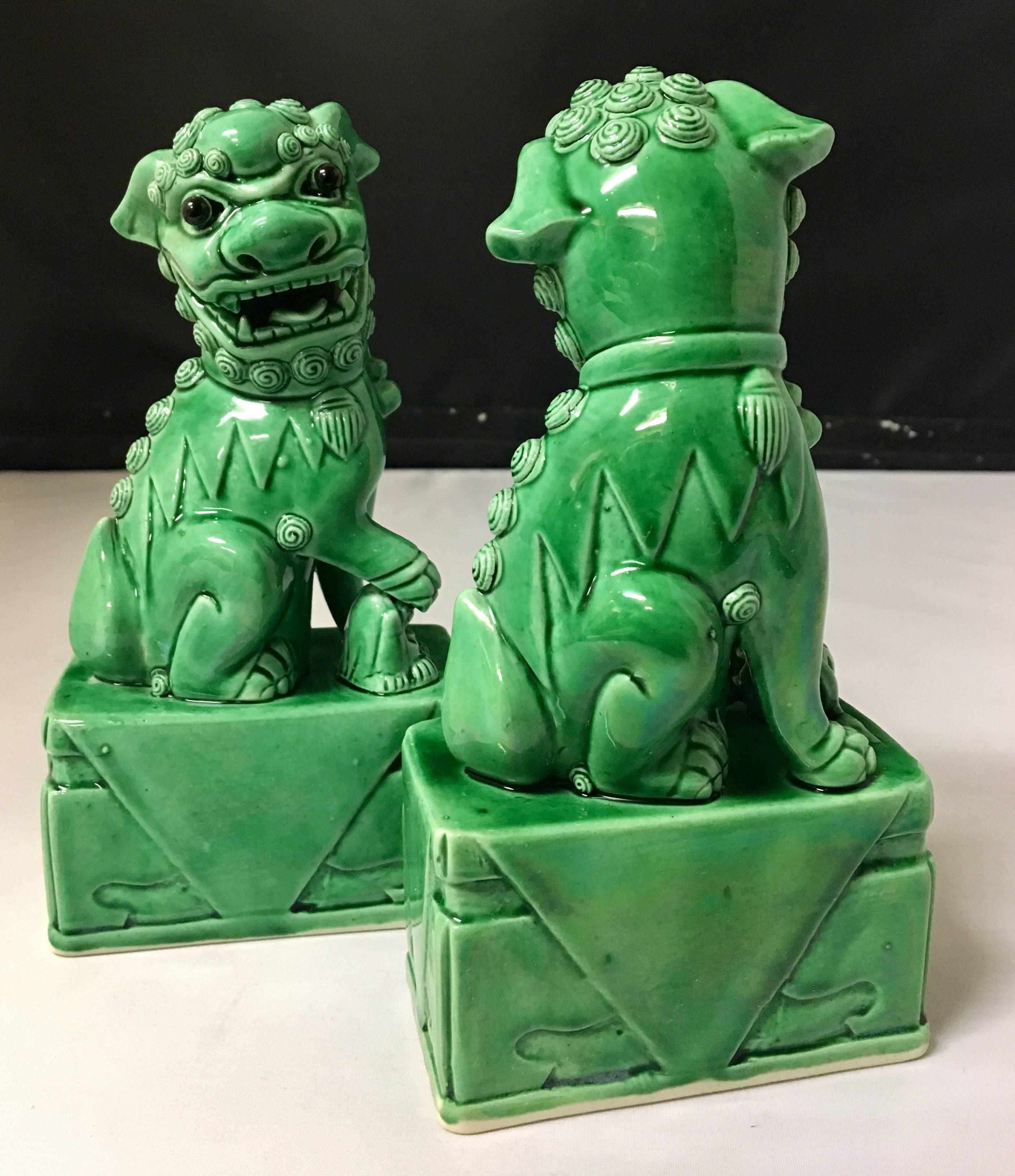 A very nice pair of vintage, emerald green, ceramic foo dogs from Japan. Excellent condition and patina; makes a fun decor item in any room!