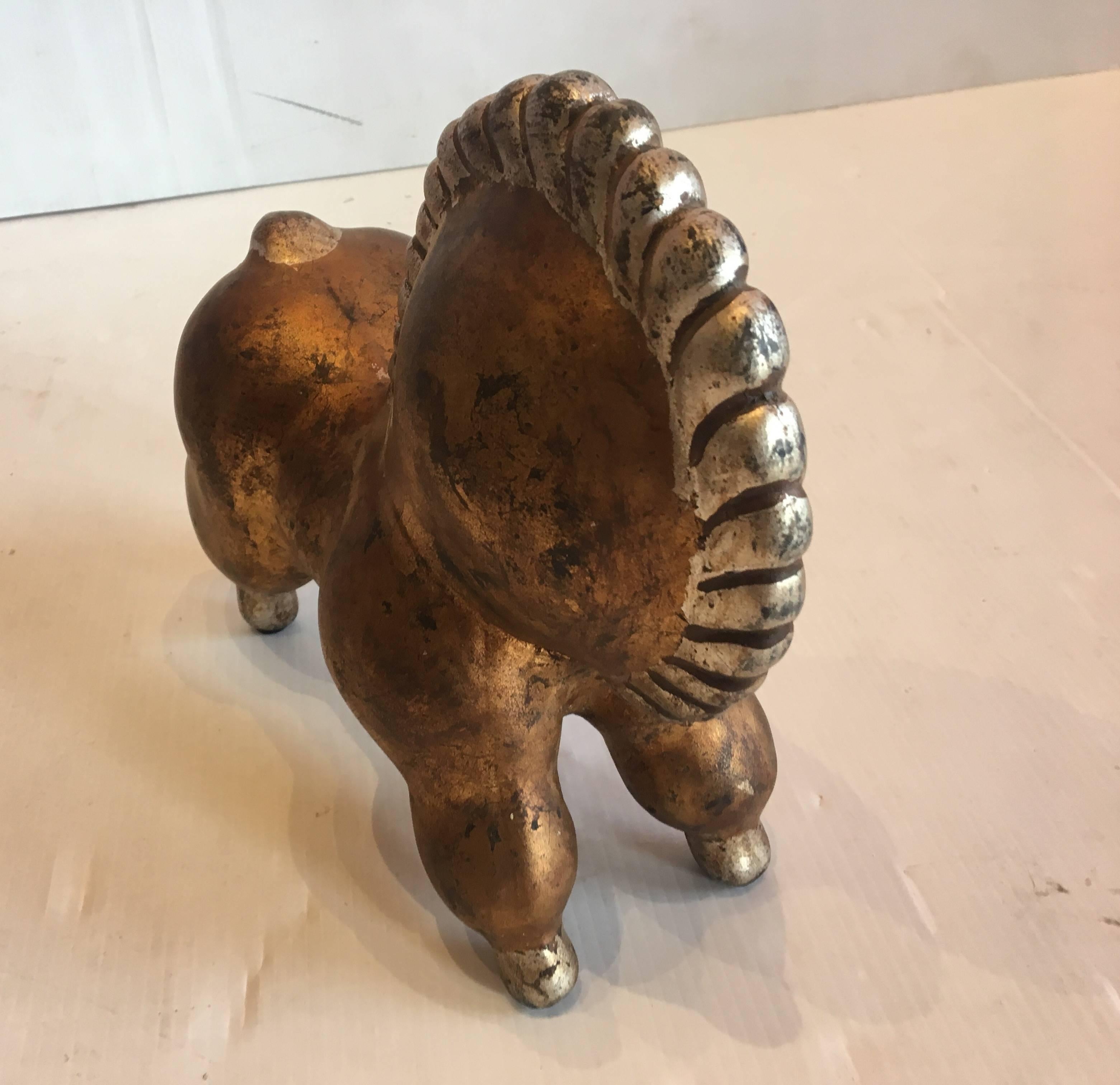 Beautiful and unique ceramic horse in the style of Russel Wright, circa 1950s in ceramic with gold and silver finish.