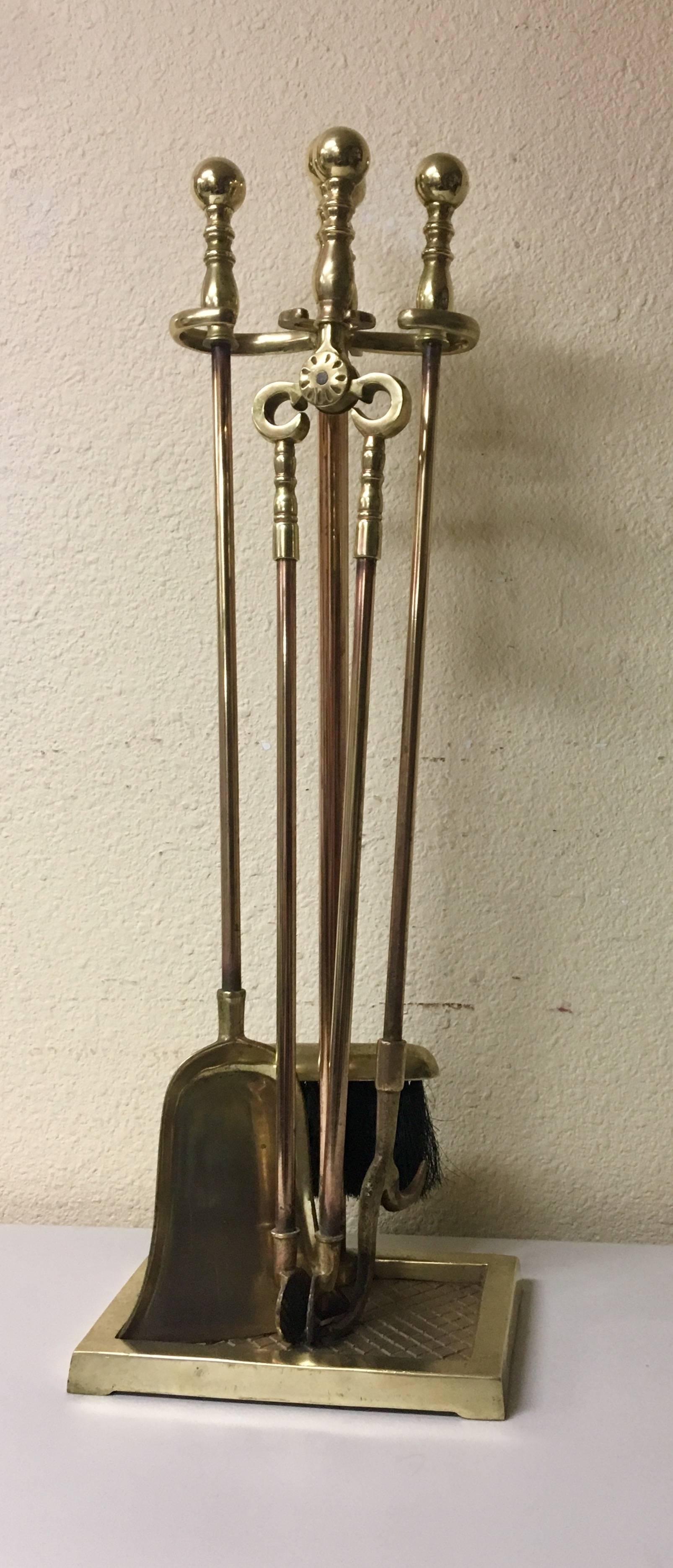 Elegant polished solid brass fireplace tools set with rose and gold brass finish. Very heavy and wonderful quality a great, sophisticated look!
