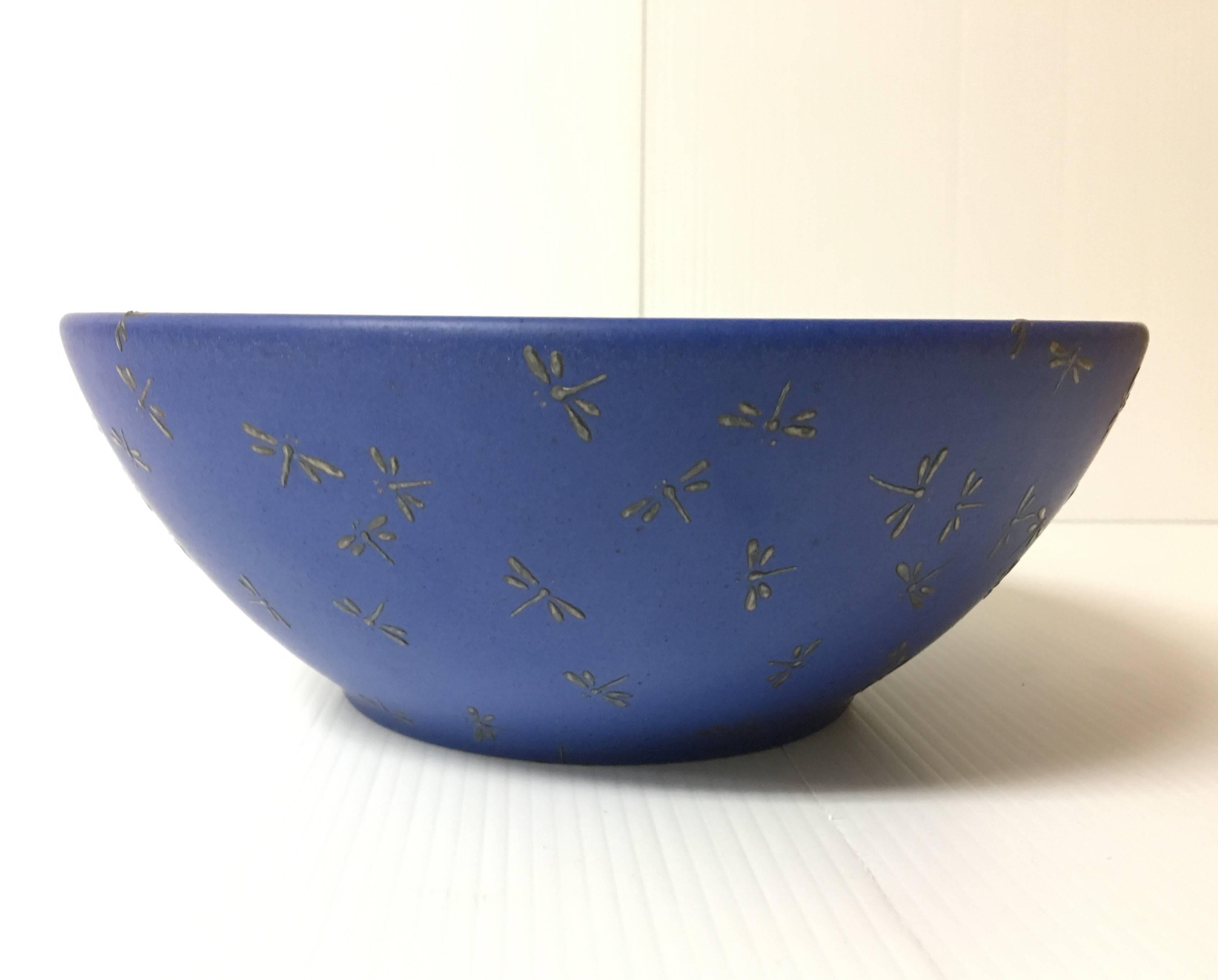 Well done ceramic bowl designed by Emilia Castillo for Los Castillo made in Mexico. Pure silver dragonfly motif incrustations on a cobalt ceramic bowl (9.5" diameter). Signed at the bottom.