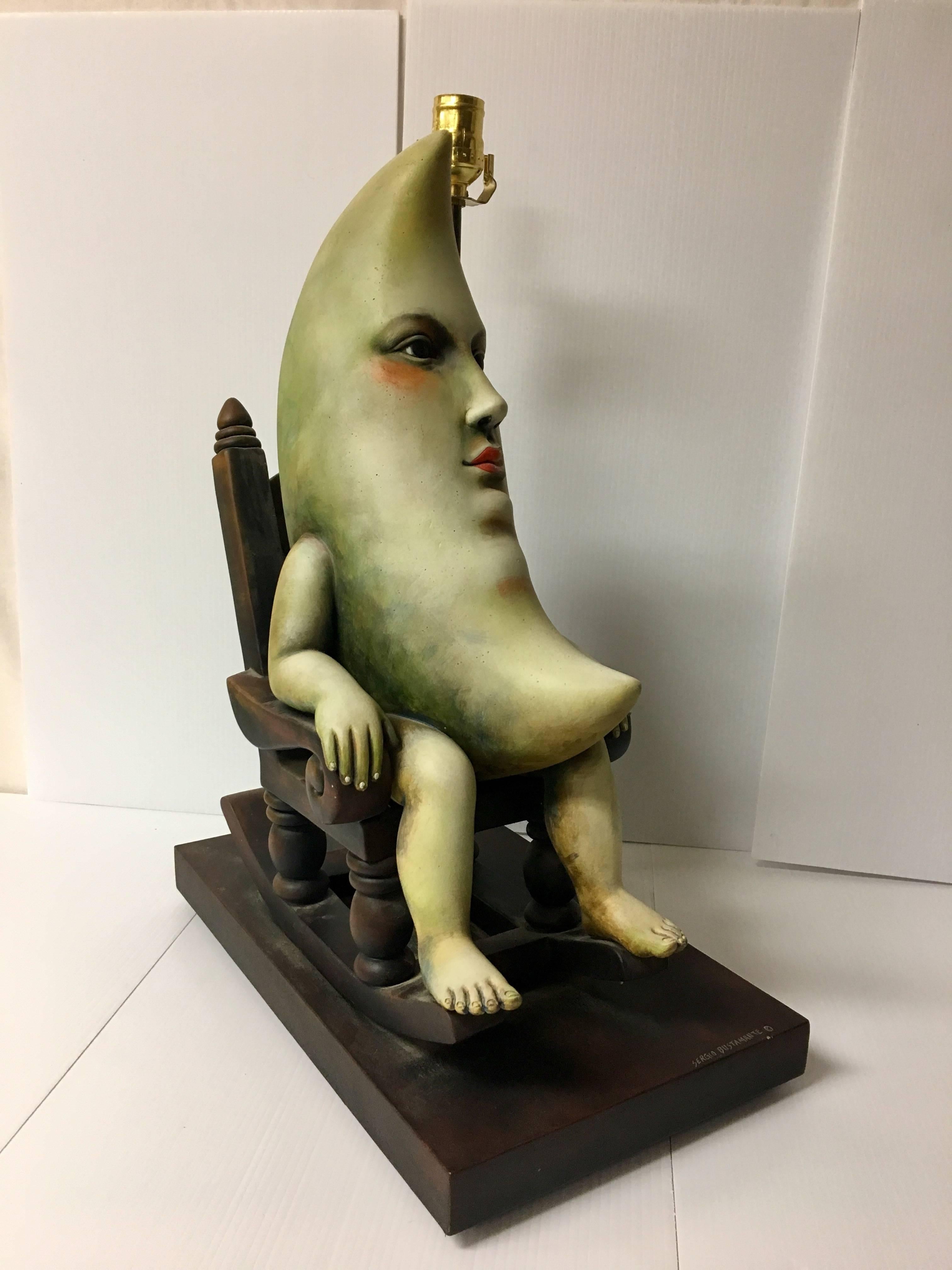 A magnificent and unique table lamp by Mexican artist Sergio Bustamante. This very rare piece was acquired directly from the artist in the 1980s. The lamps base is 20";it is 28" to the top of the harp. The piece is in excellent condition
